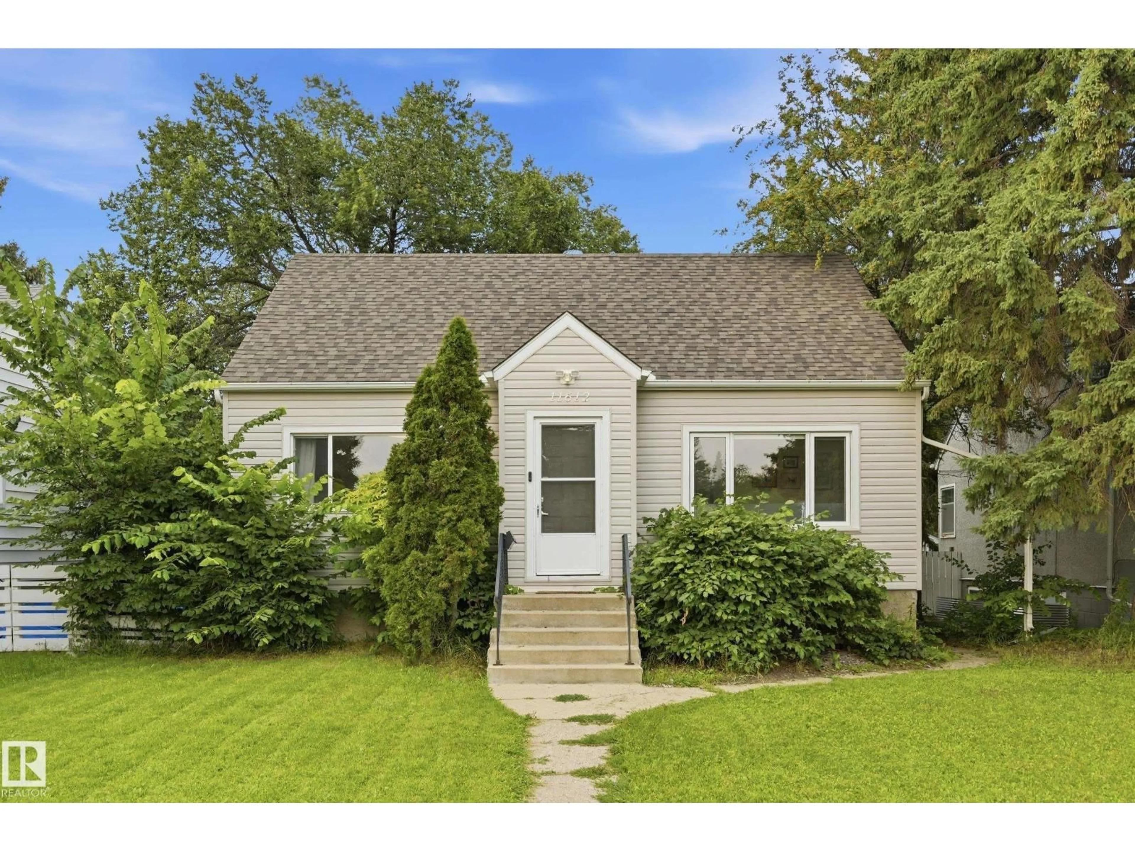 Home with vinyl exterior material, street for 11612 110A AV, Edmonton Alberta T5H1K6