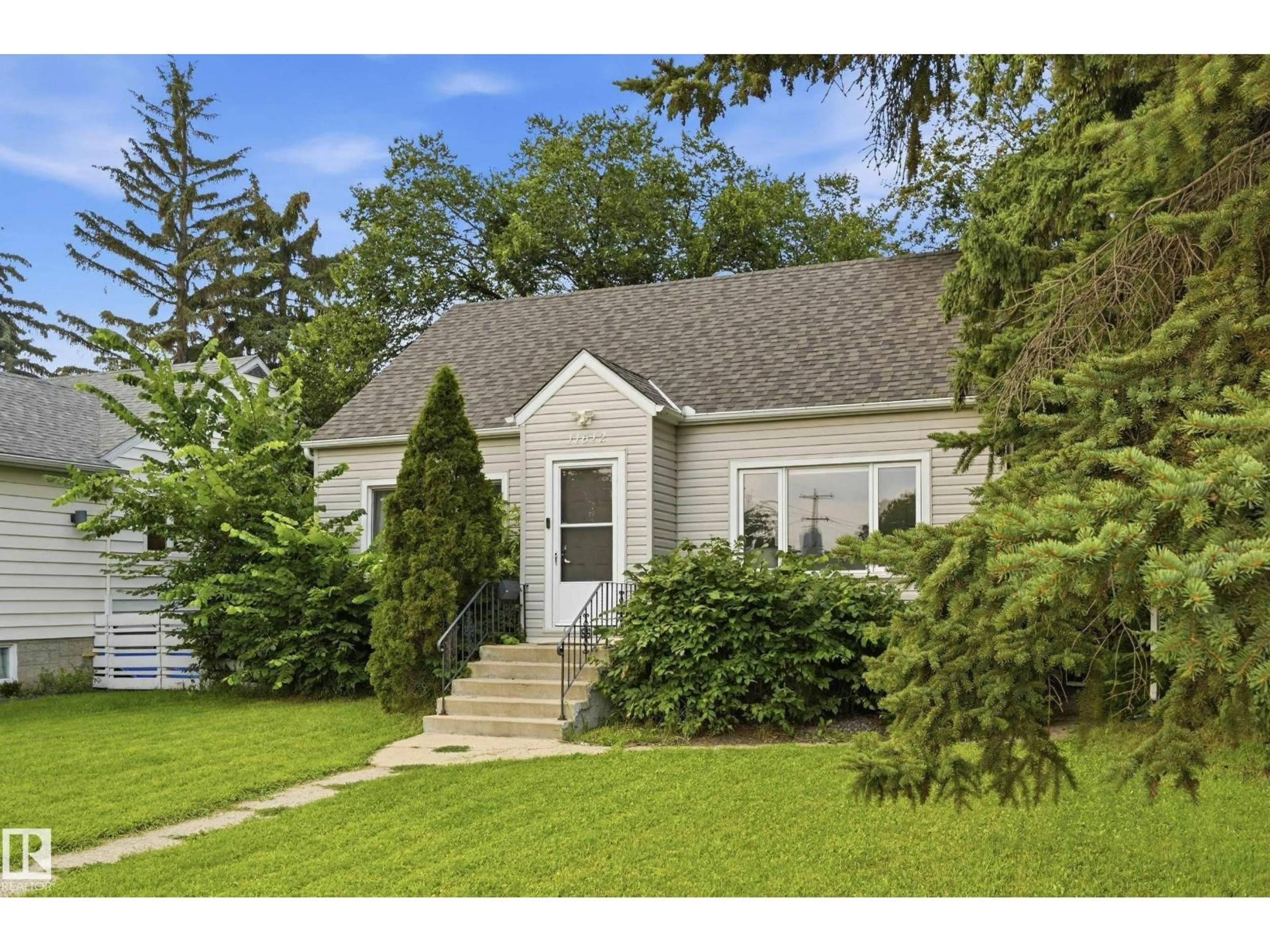 Home with vinyl exterior material, street for 11612 110A AV, Edmonton Alberta T5H1K6