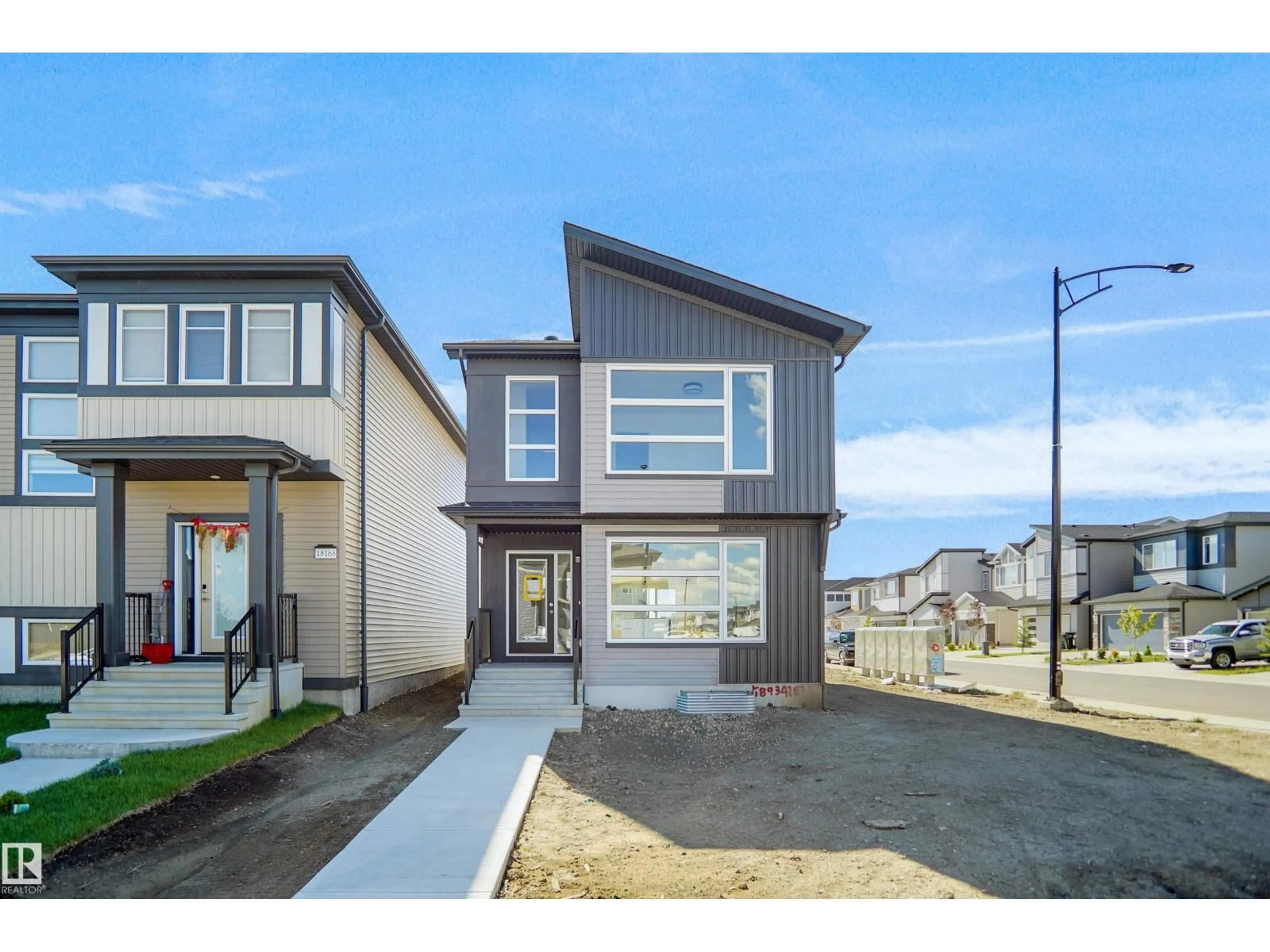 Home with vinyl exterior material, street for 110 JUNIPER WD, Fort Saskatchewan Alberta T8L3S4