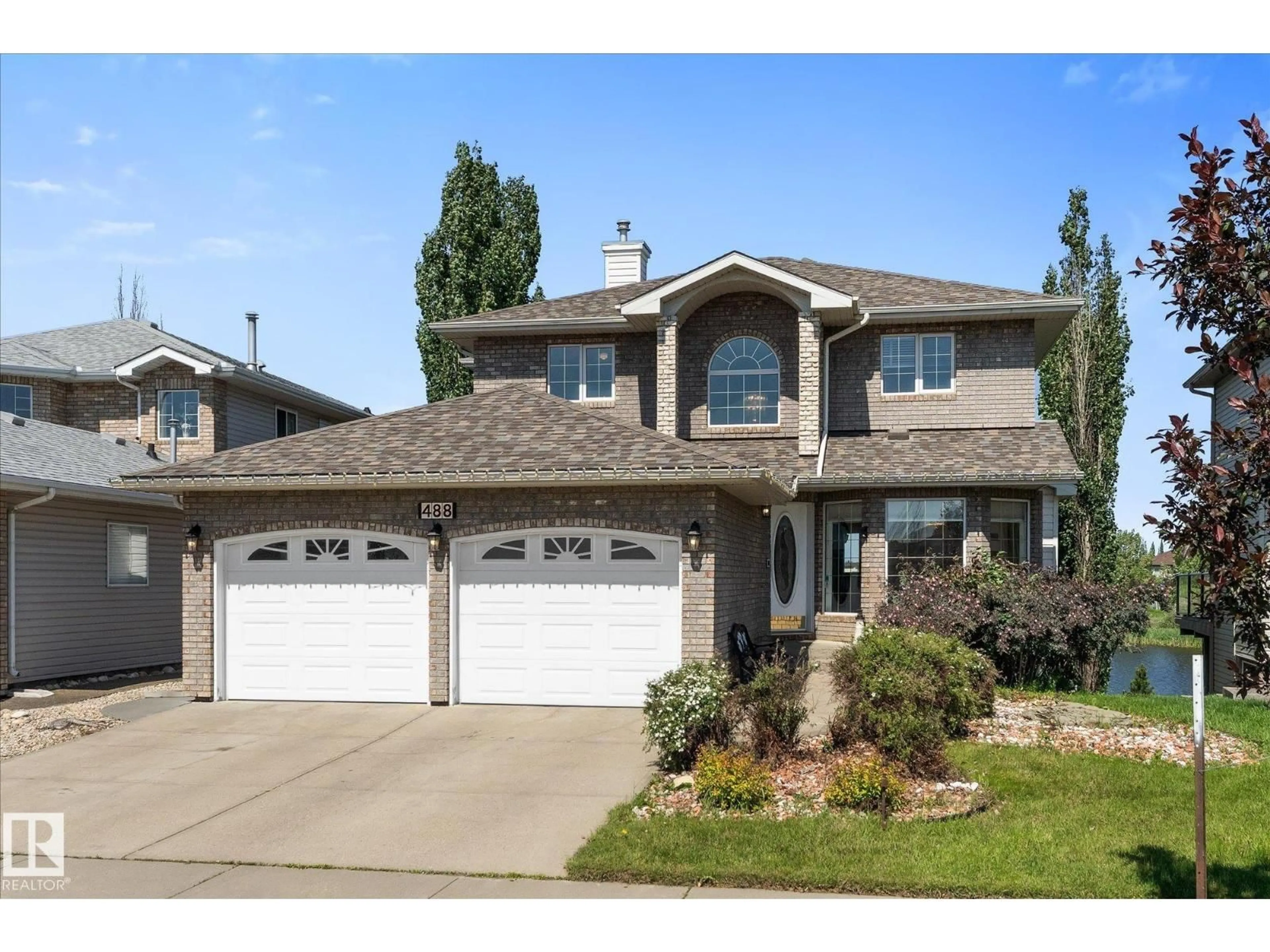 Home with vinyl exterior material, street for 488 KLARVATTEN LAKE WD, Edmonton Alberta T5Z3G7