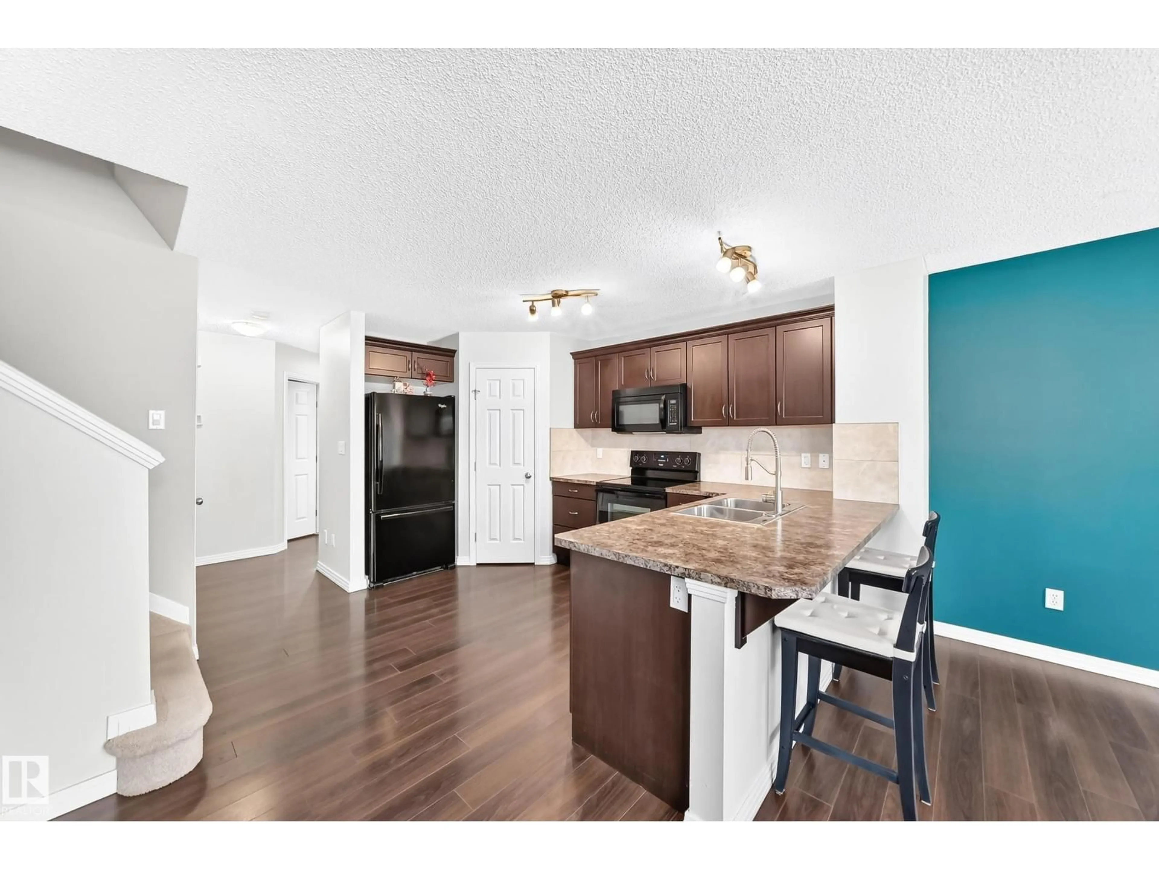 Open concept kitchen, wood/laminate floor for 3920 6 ST, Edmonton Alberta T6T0T5