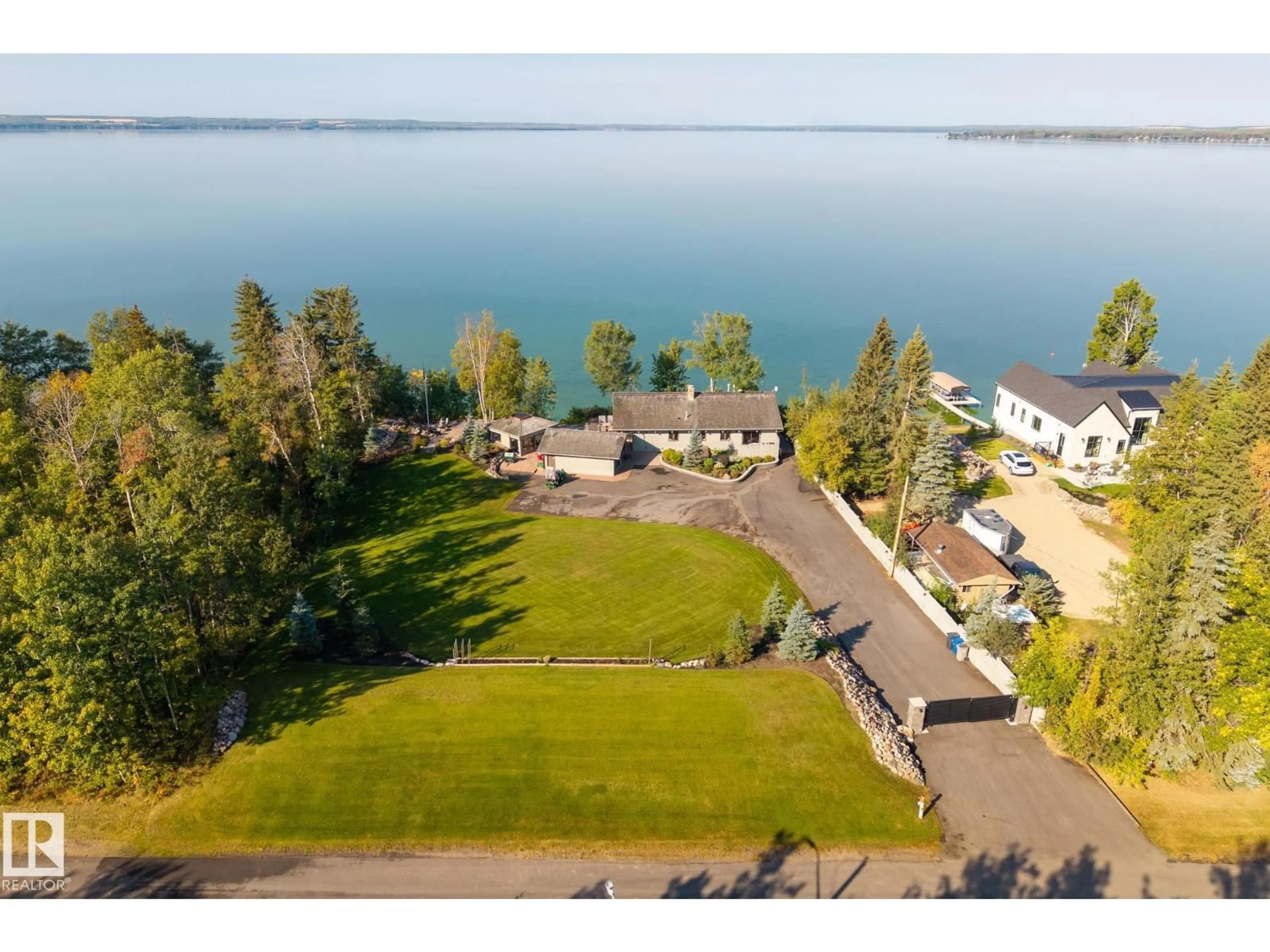 A pic from outside/outdoor area/front of a property/back of a property/a pic from drone, water/lake/river/ocean view for 139 SILVER BEACH RD, Rural Wetaskiwin County Alberta T0C2C0
