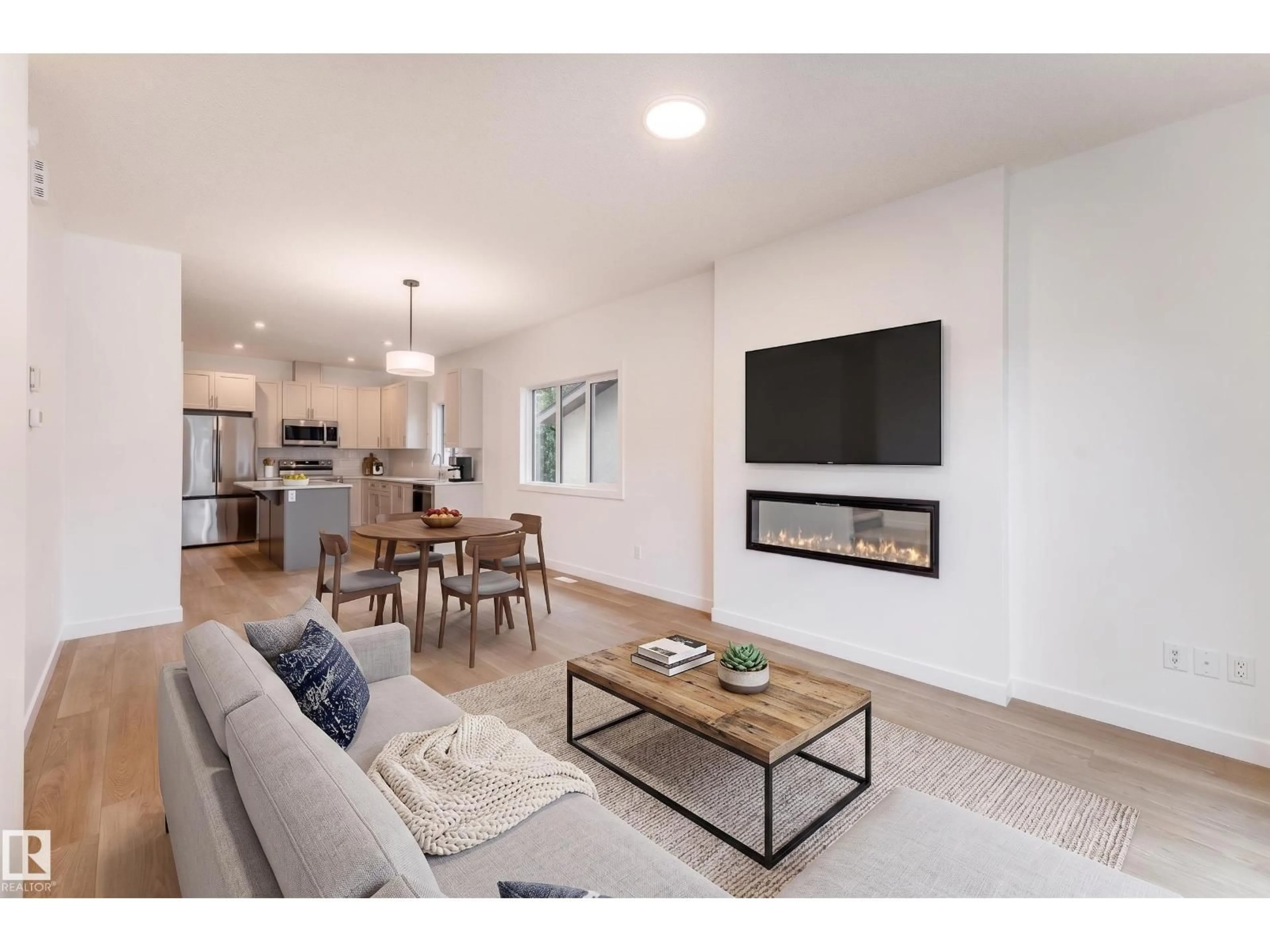 Living room with furniture, wood/laminate floor for NW - 10916 & 10918 154 STREET, Edmonton Alberta T5P2J9