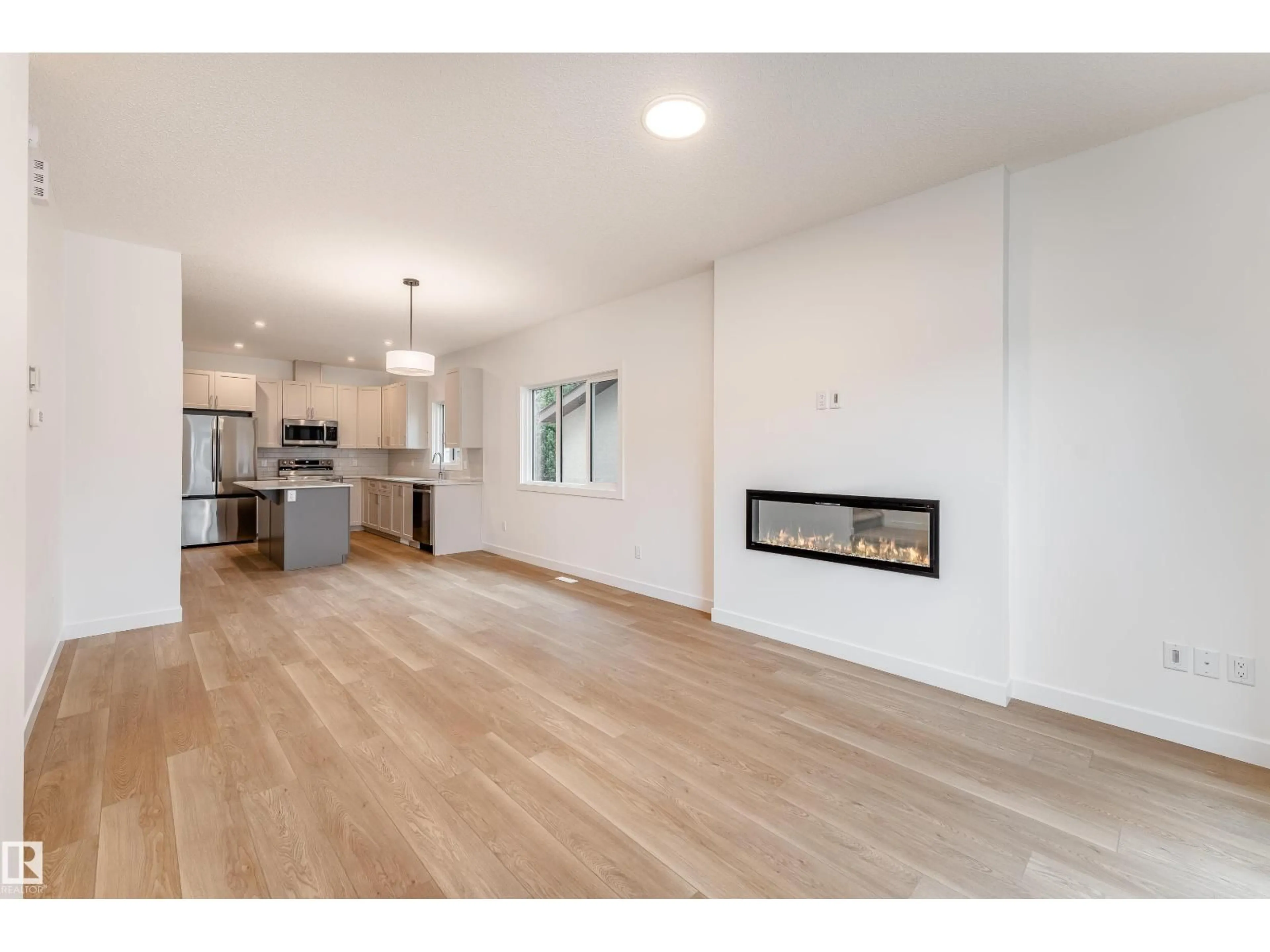 Open concept kitchen, wood/laminate floor for NW - 10916 & 10918 154 STREET, Edmonton Alberta T5P2J9