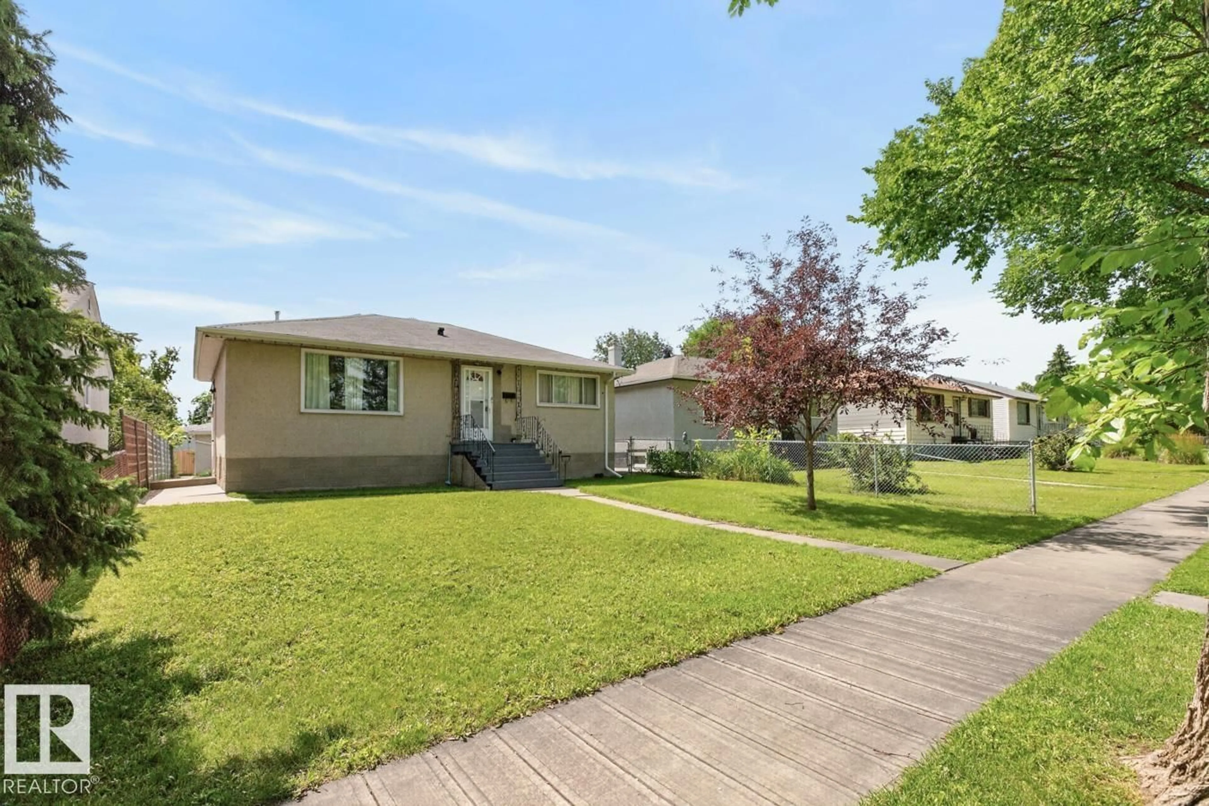Home with vinyl exterior material, street for NW - 9419 65 AV, Edmonton Alberta T6E0K1
