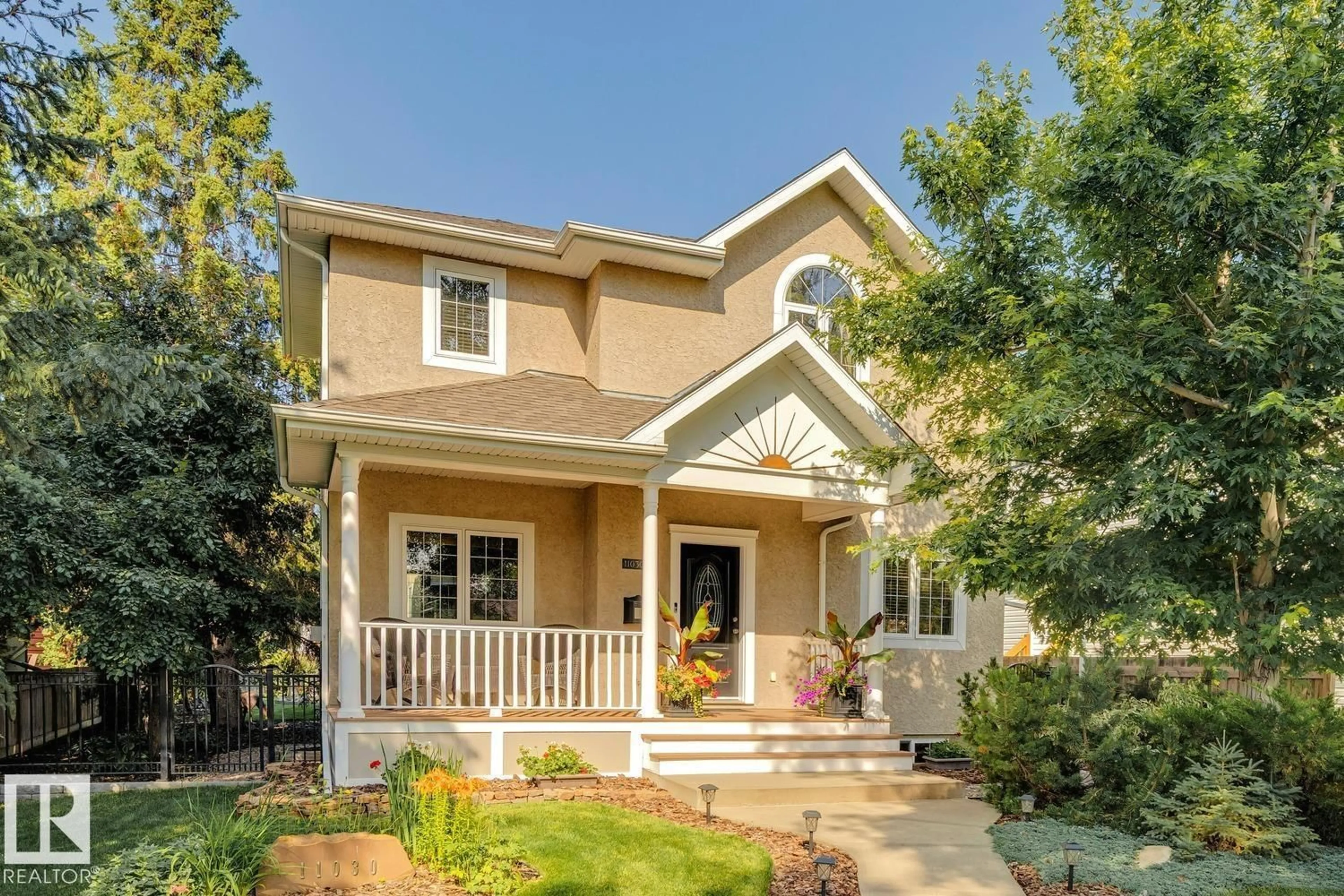 Home with vinyl exterior material, street for NW - 11030 122 ST, Edmonton Alberta T5M0B3