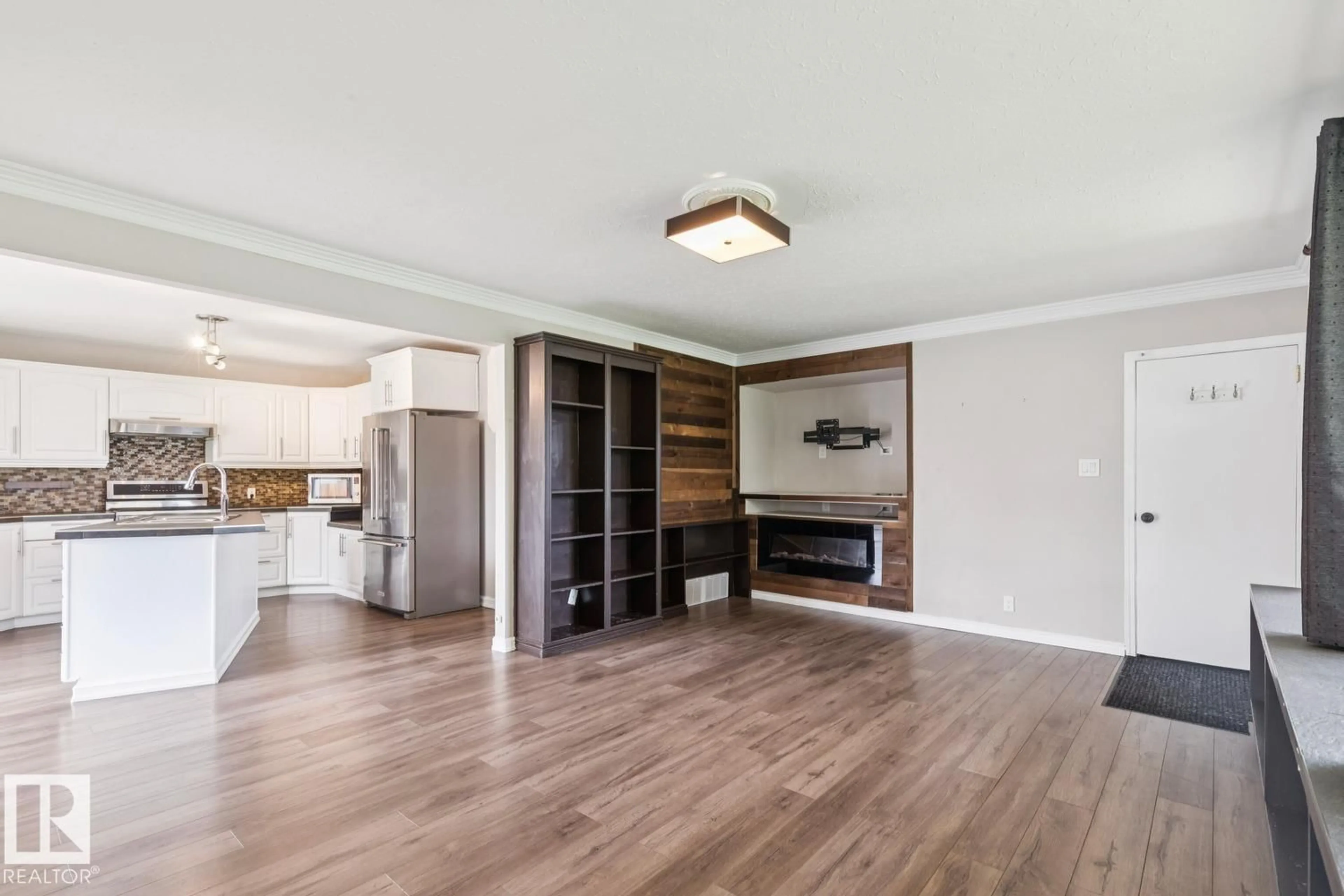 Open concept kitchen, wood/laminate floor for NW - 10151 71 ST, Edmonton Alberta T6A2V6