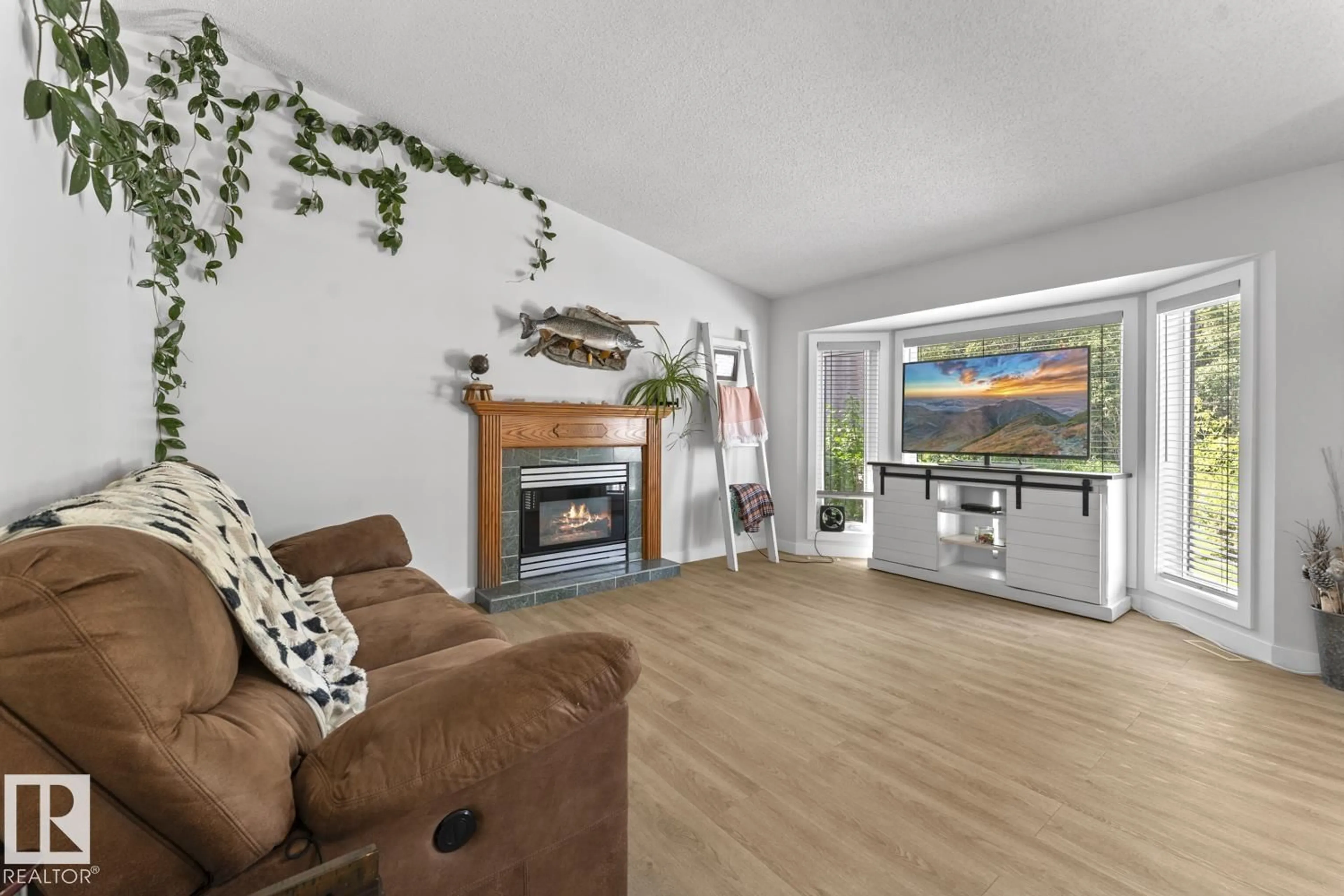 Living room with furniture, wood/laminate floor for 1004 12 ST, Cold Lake Alberta T9M1K2