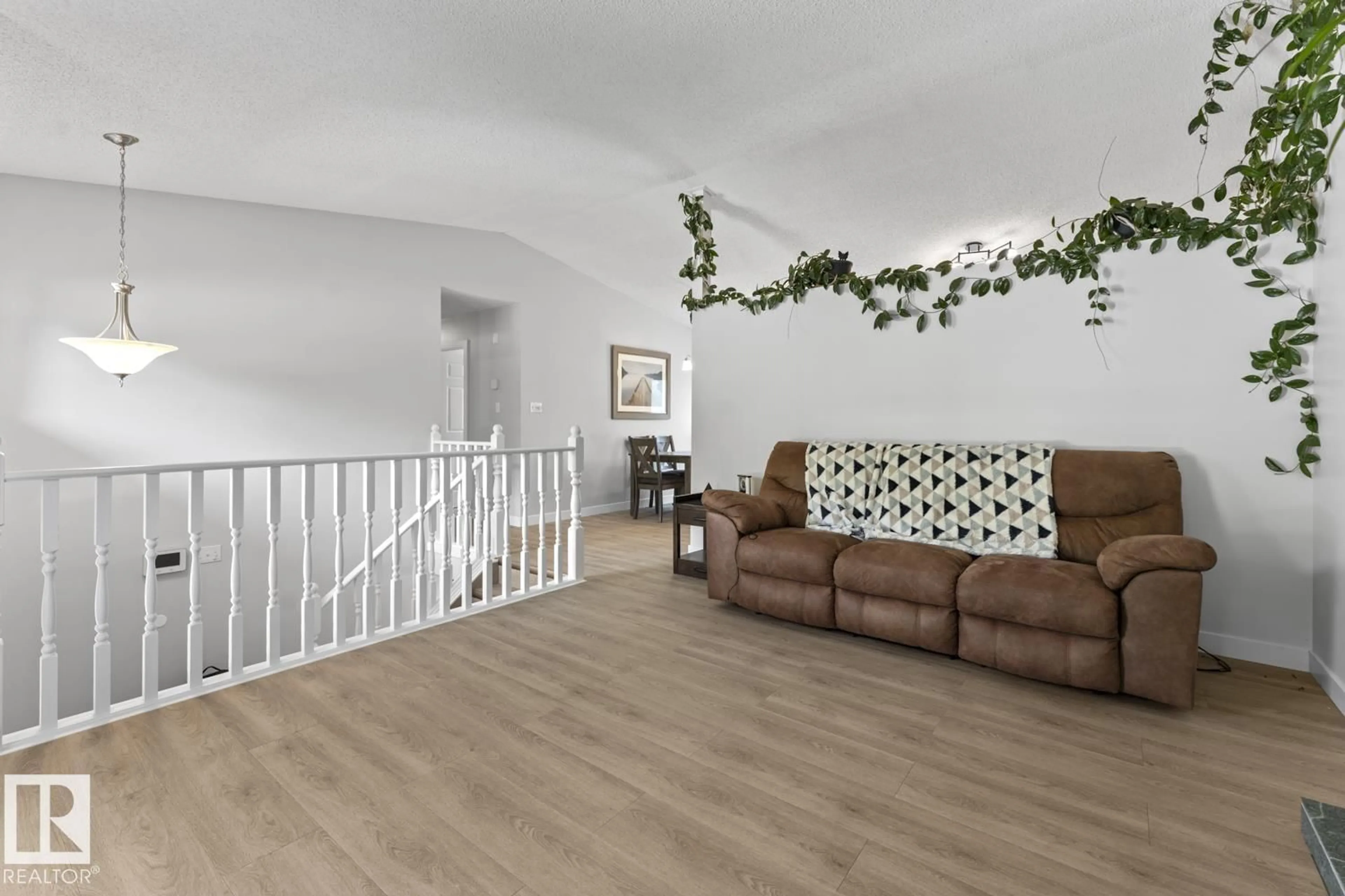 Living room with furniture, wood/laminate floor for 1004 12 ST, Cold Lake Alberta T9M1K2