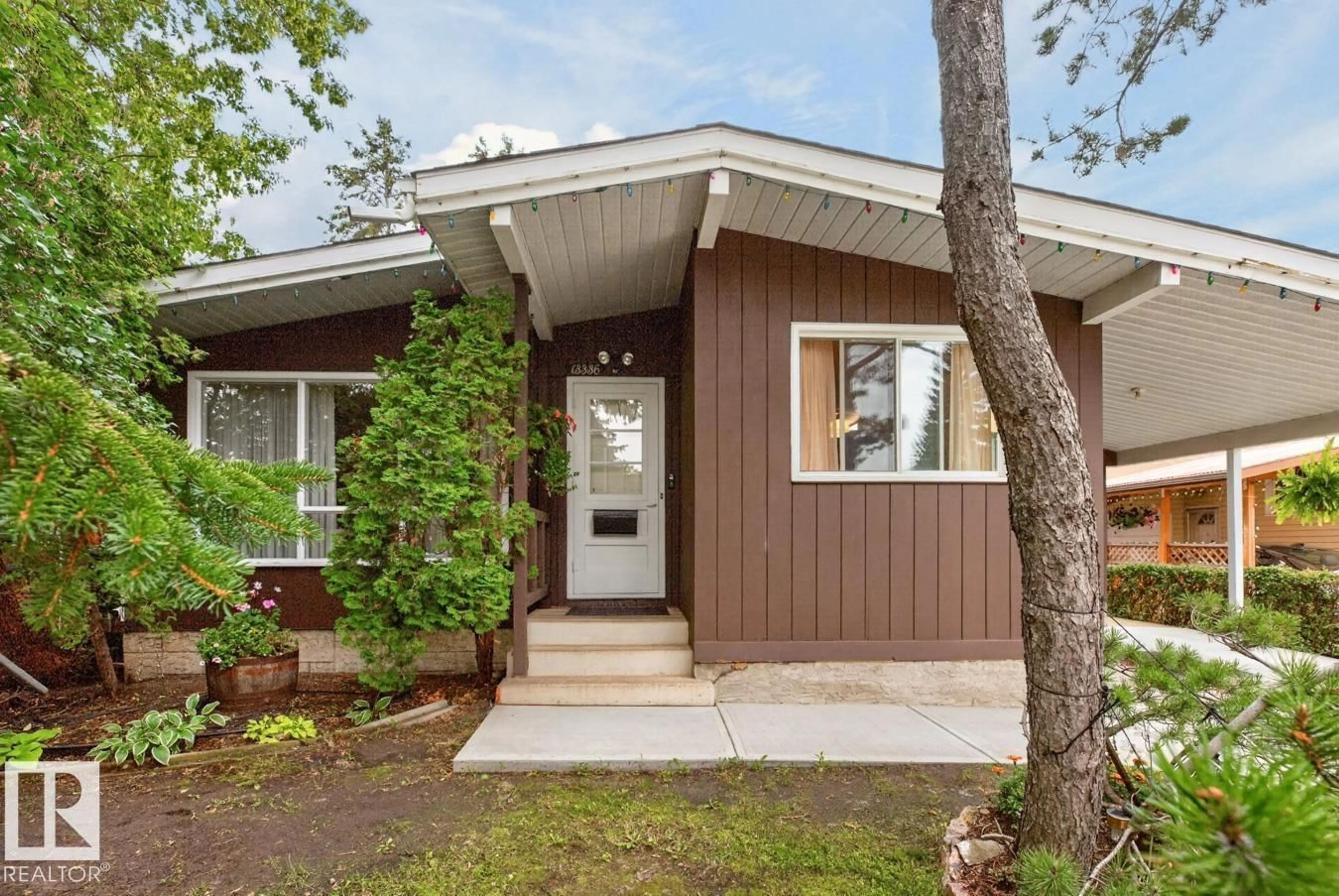 Home with vinyl exterior material, street for 13336 106 ST, Edmonton Alberta T5E4T6