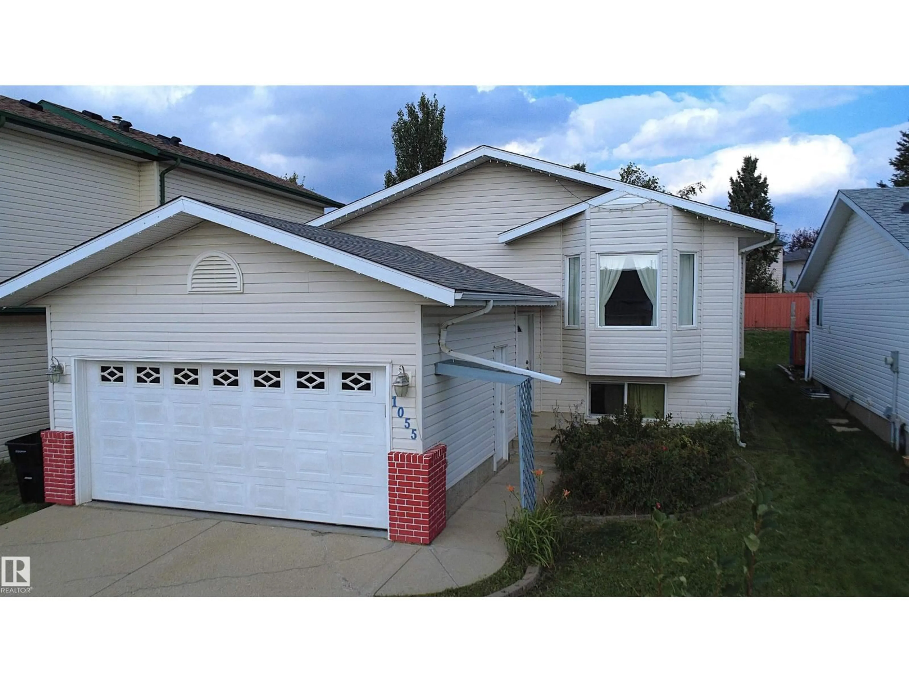 Home with vinyl exterior material, street for 1055 JONES CR, Edmonton Alberta T6L6Y1