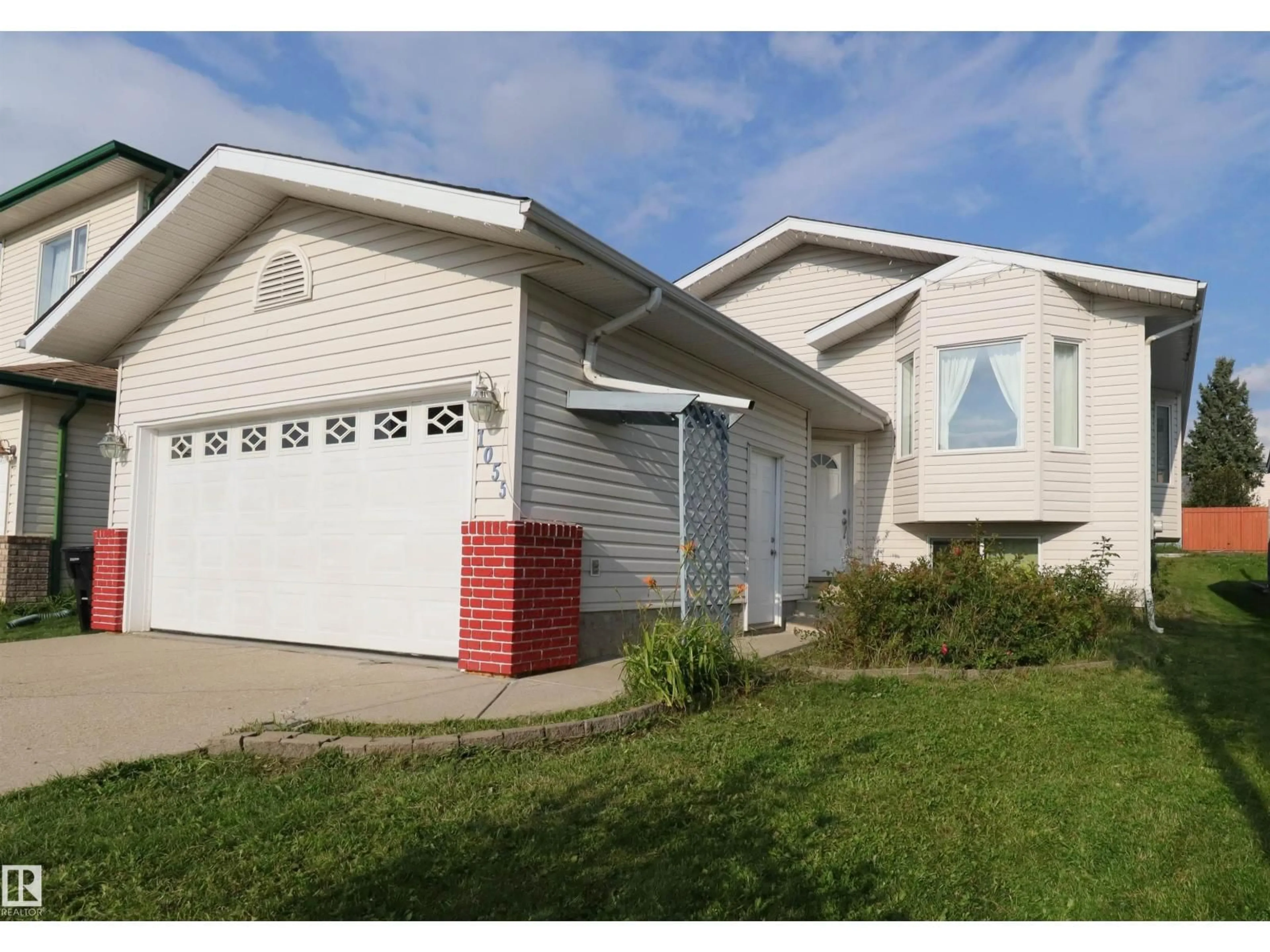 Home with vinyl exterior material, street for 1055 JONES CR, Edmonton Alberta T6L6Y1