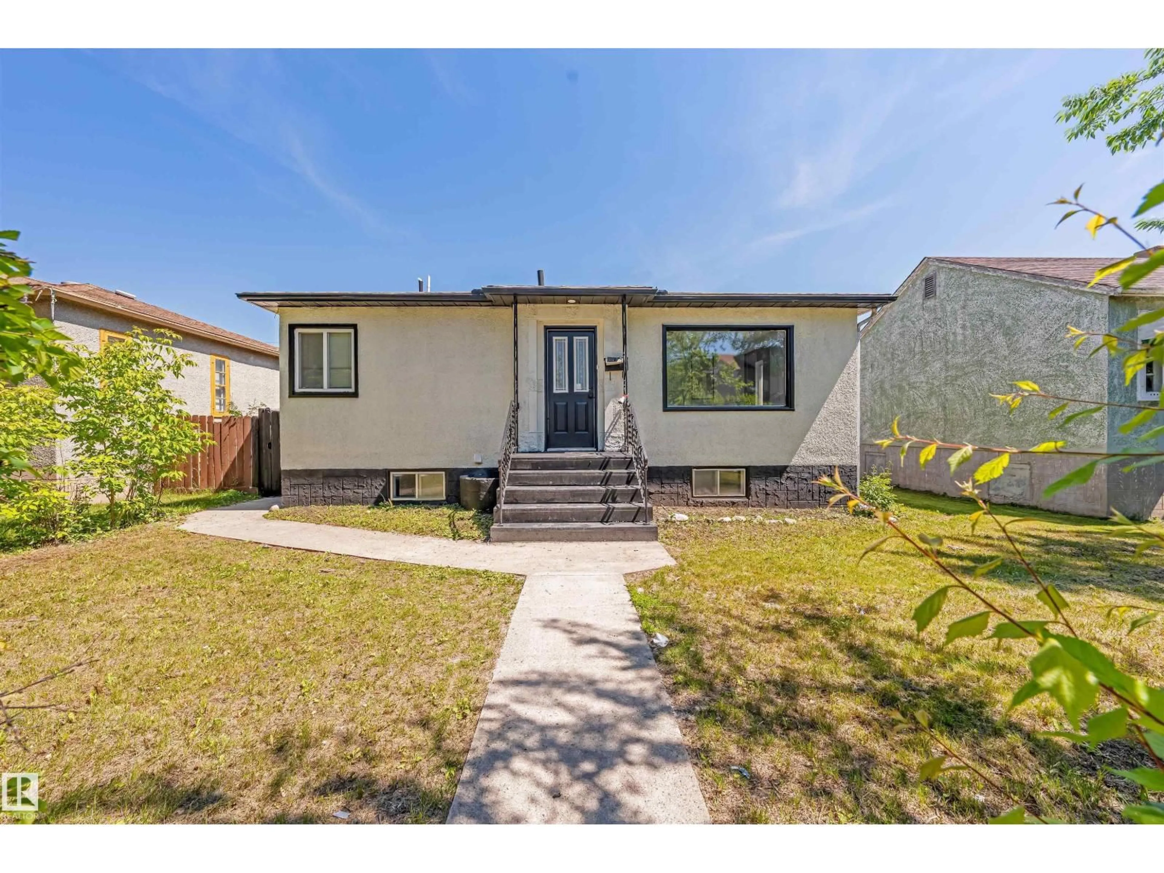Home with vinyl exterior material, street for NW - 11927 68 ST, Edmonton Alberta T5B1P8