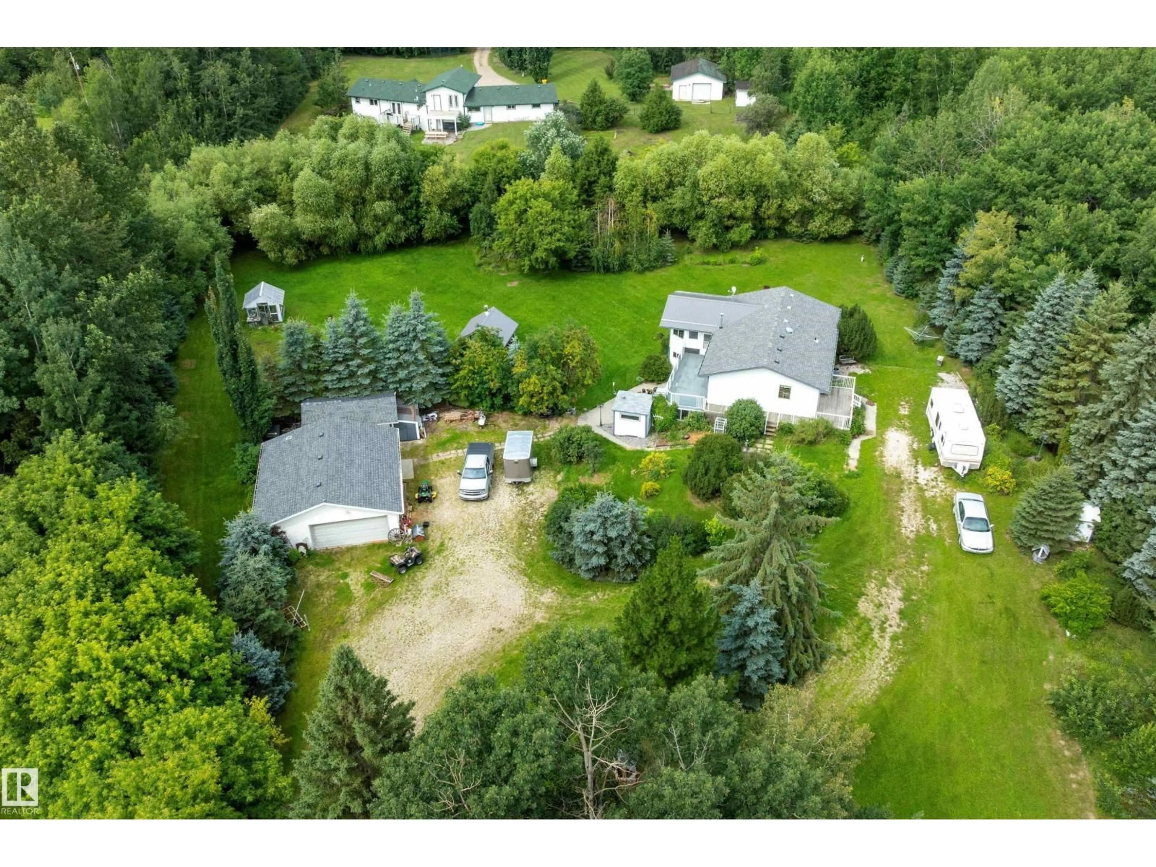 A pic from outside/outdoor area/front of a property/back of a property/a pic from drone, unknown for 52502 - 104 RGE ROAD 25, Rural Parkland County Alberta T7Y2M2
