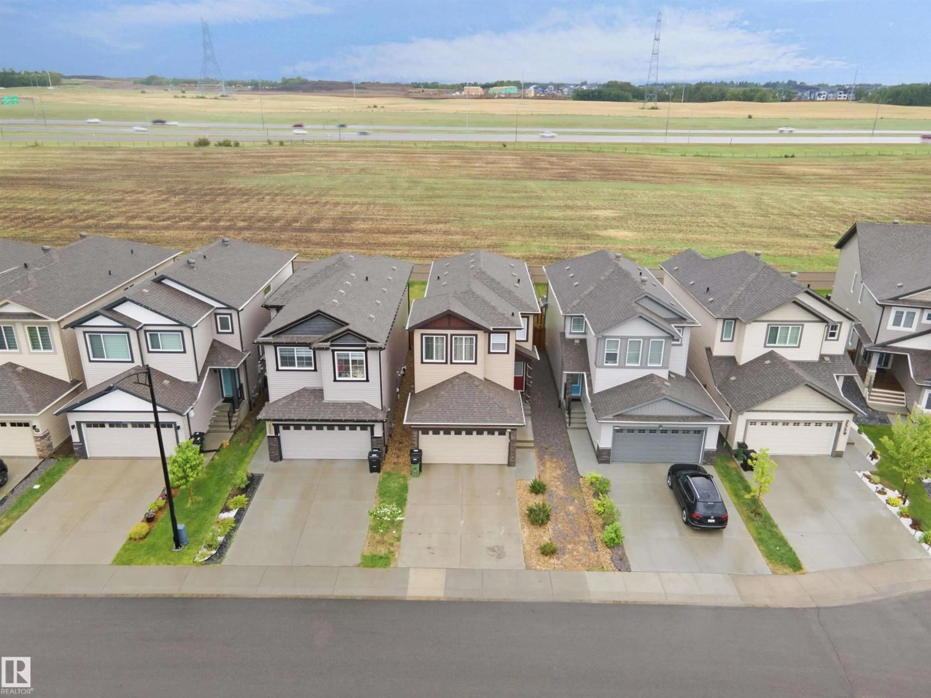 A pic from outside/outdoor area/front of a property/back of a property/a pic from drone, street for 2551 12 AV, Edmonton Alberta T6T2M6