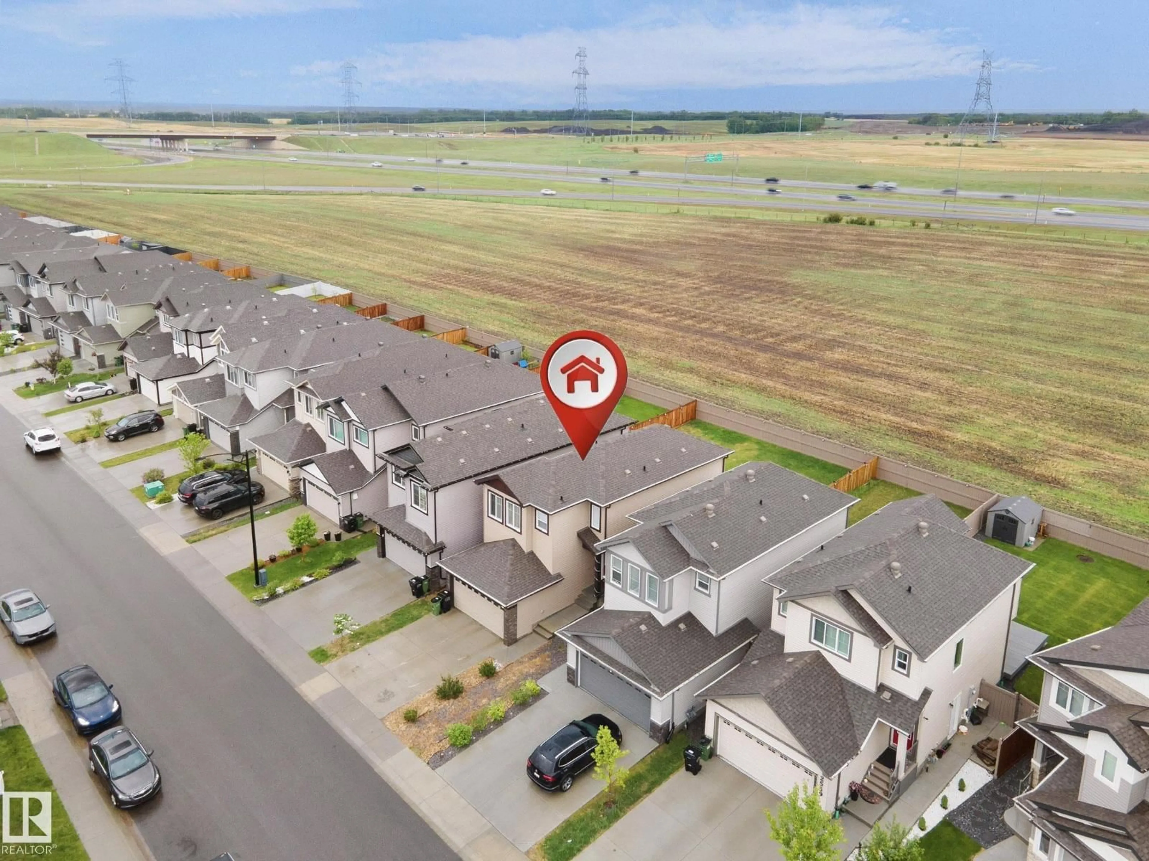 A pic from outside/outdoor area/front of a property/back of a property/a pic from drone, street for 2551 12 AV, Edmonton Alberta T6T2M6