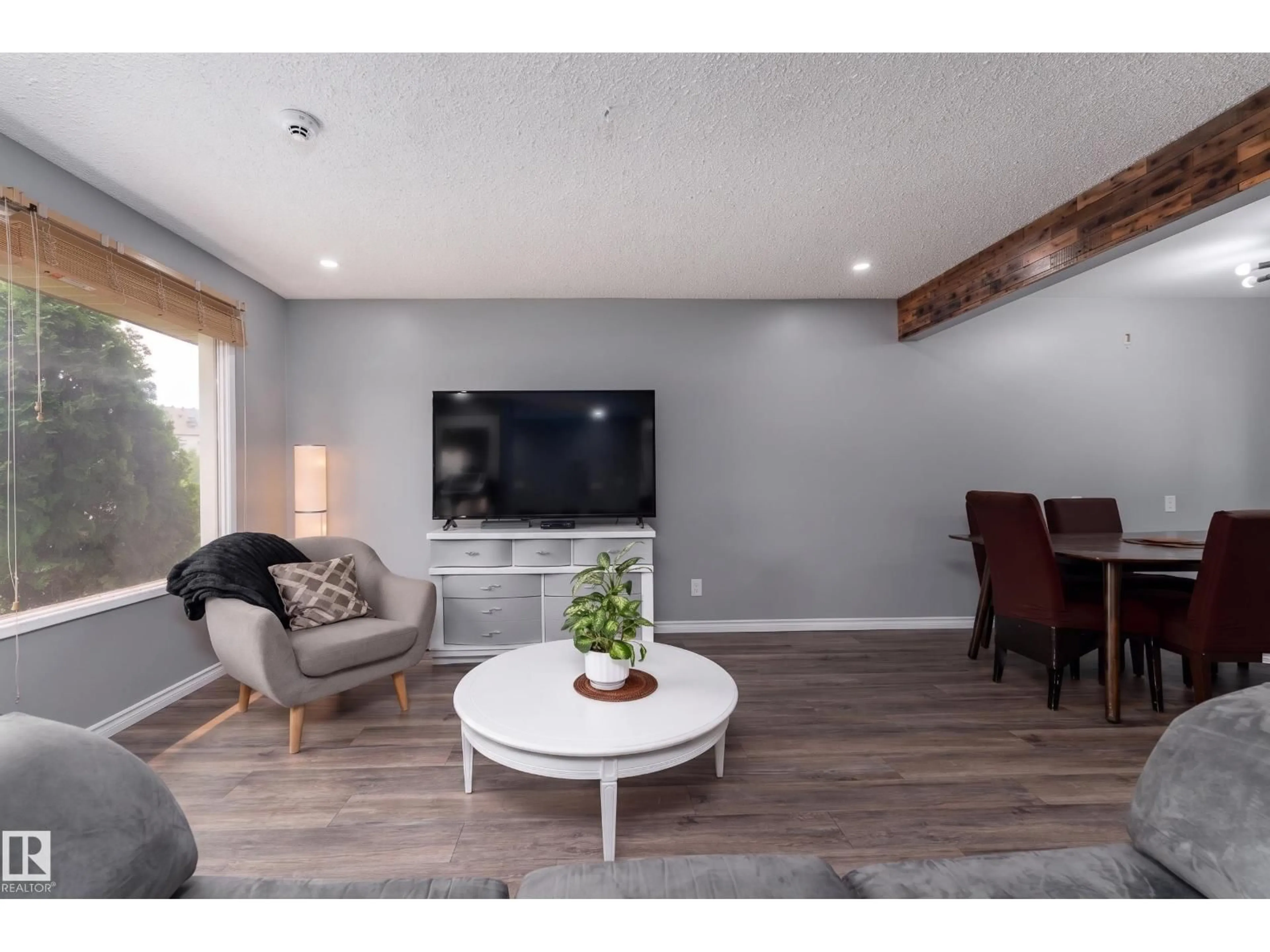 Living room with furniture, wood/laminate floor for 9012 MEADOWLARK RD, Edmonton Alberta T5R5W8