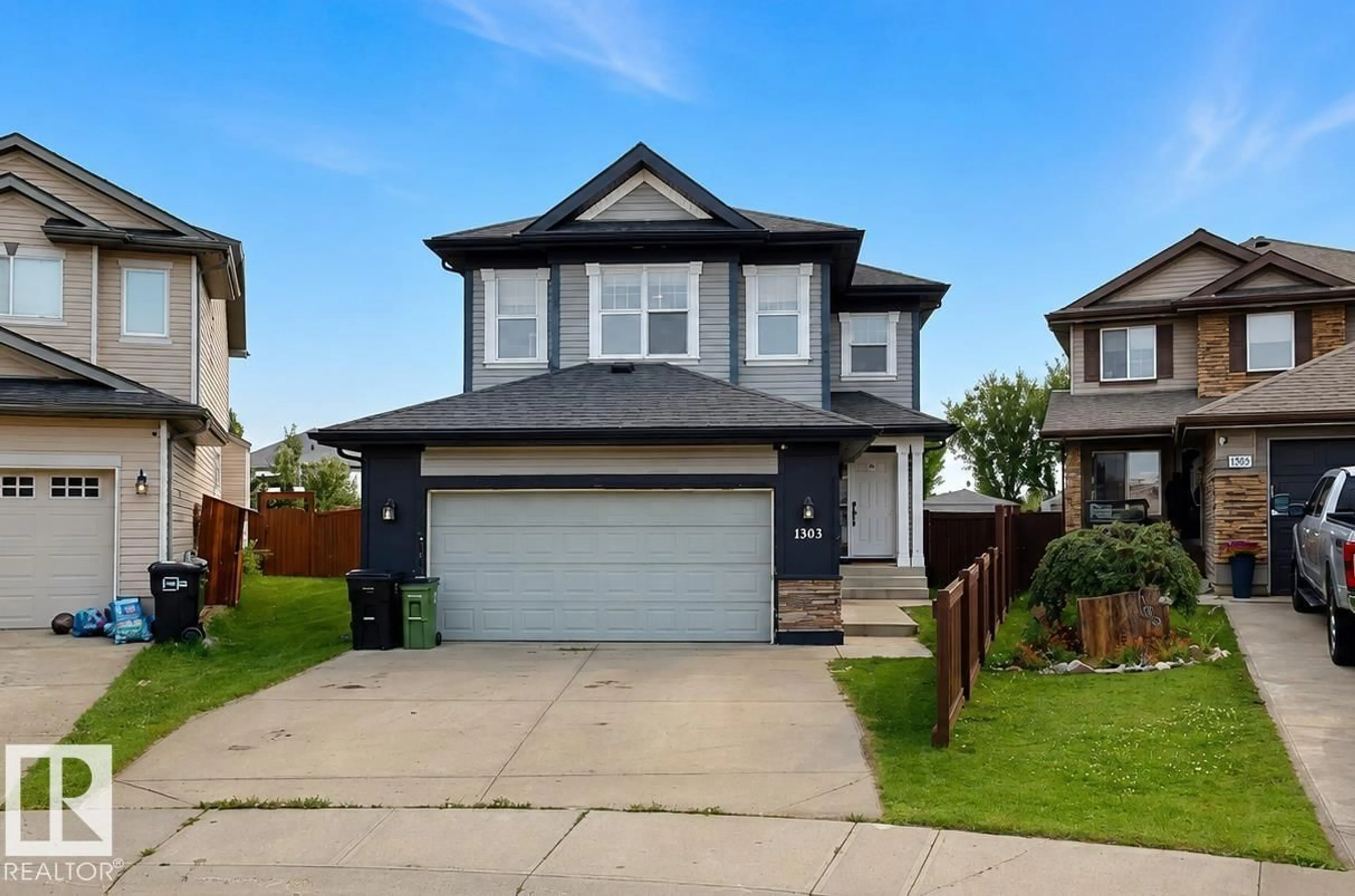 Home with vinyl exterior material, street for 1303 117ST SW, Edmonton Alberta T6W0E6