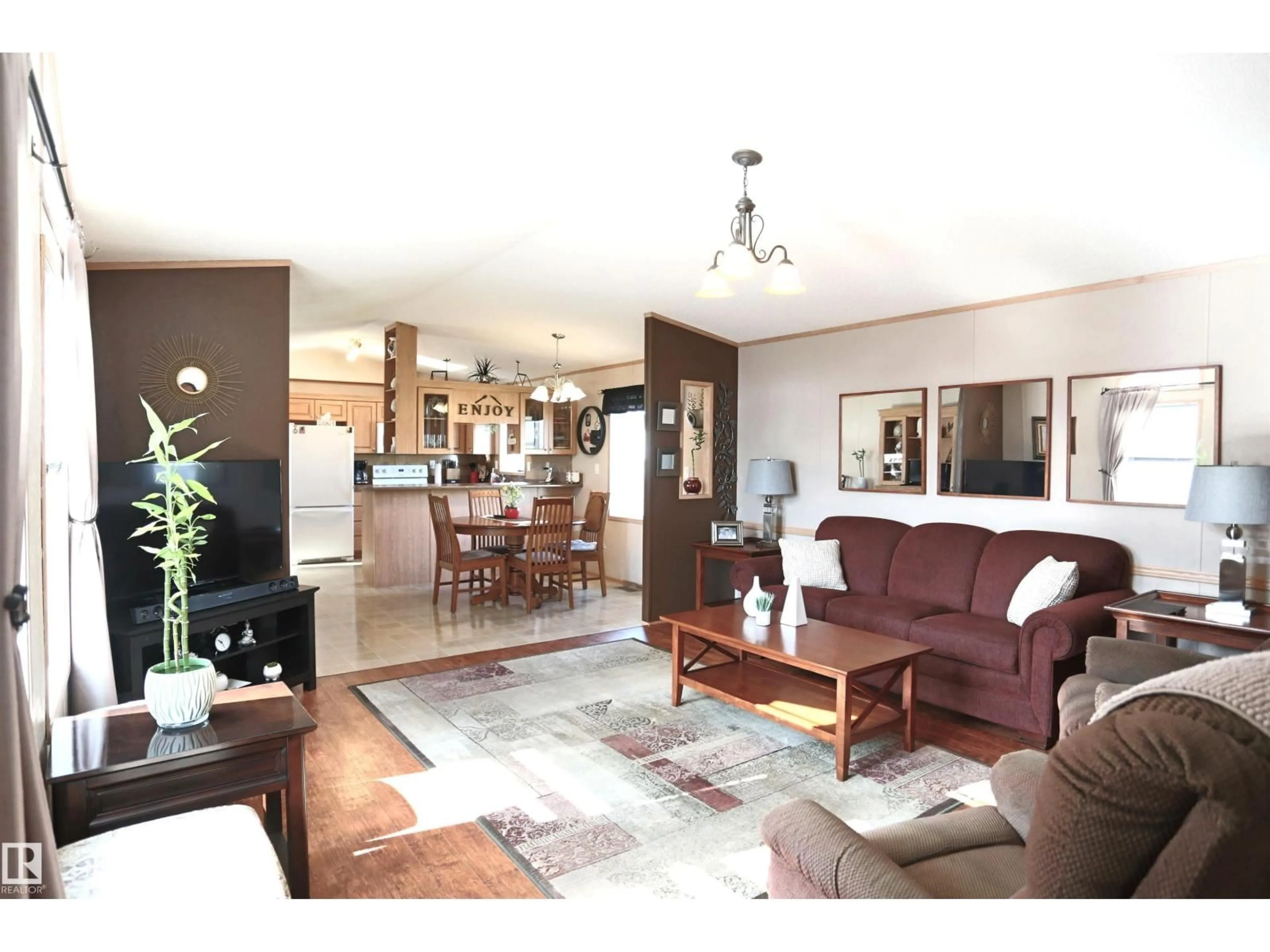 Living room with furniture, wood/laminate floor for 53222 - 1214 RR 272, Rural Parkland County Alberta T7X4K4