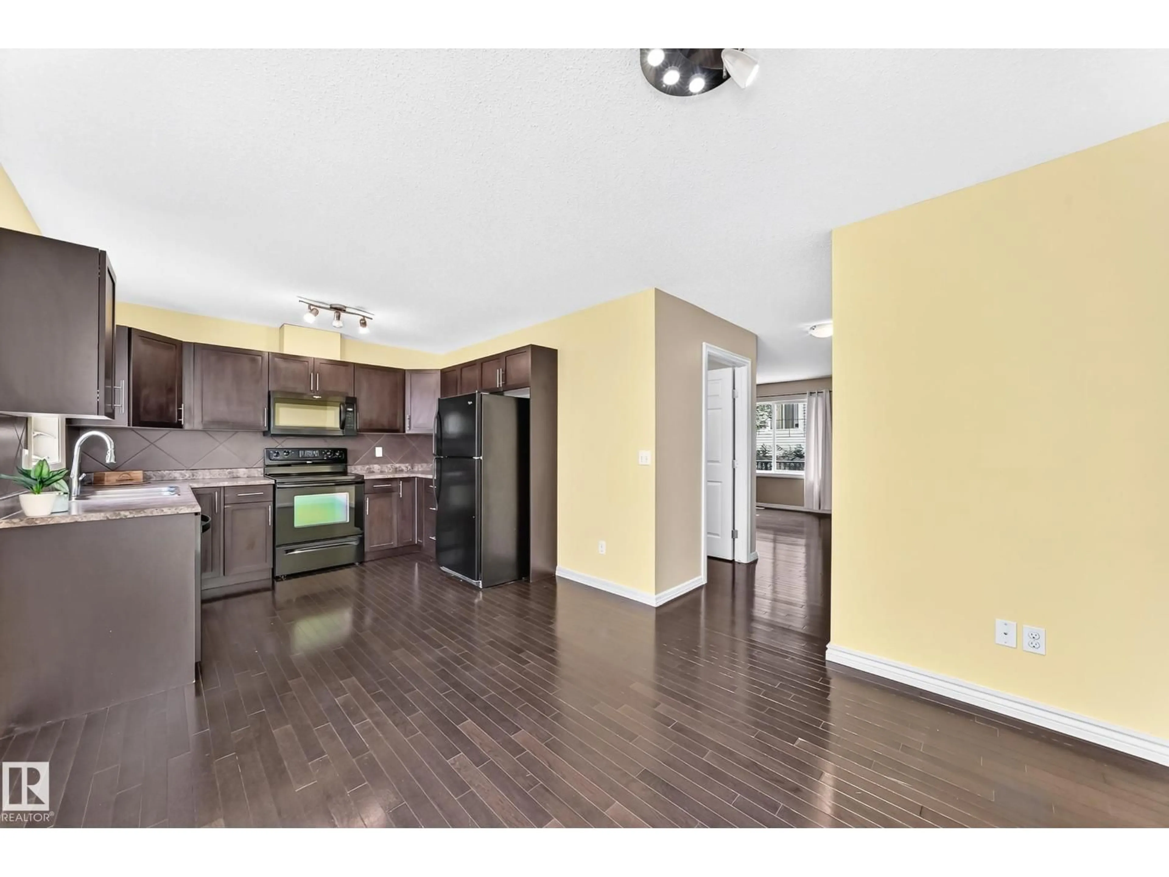 Open concept kitchen, wood/laminate floor for 82 2336 ASPEN TR, Sherwood Park Alberta T5J2V6