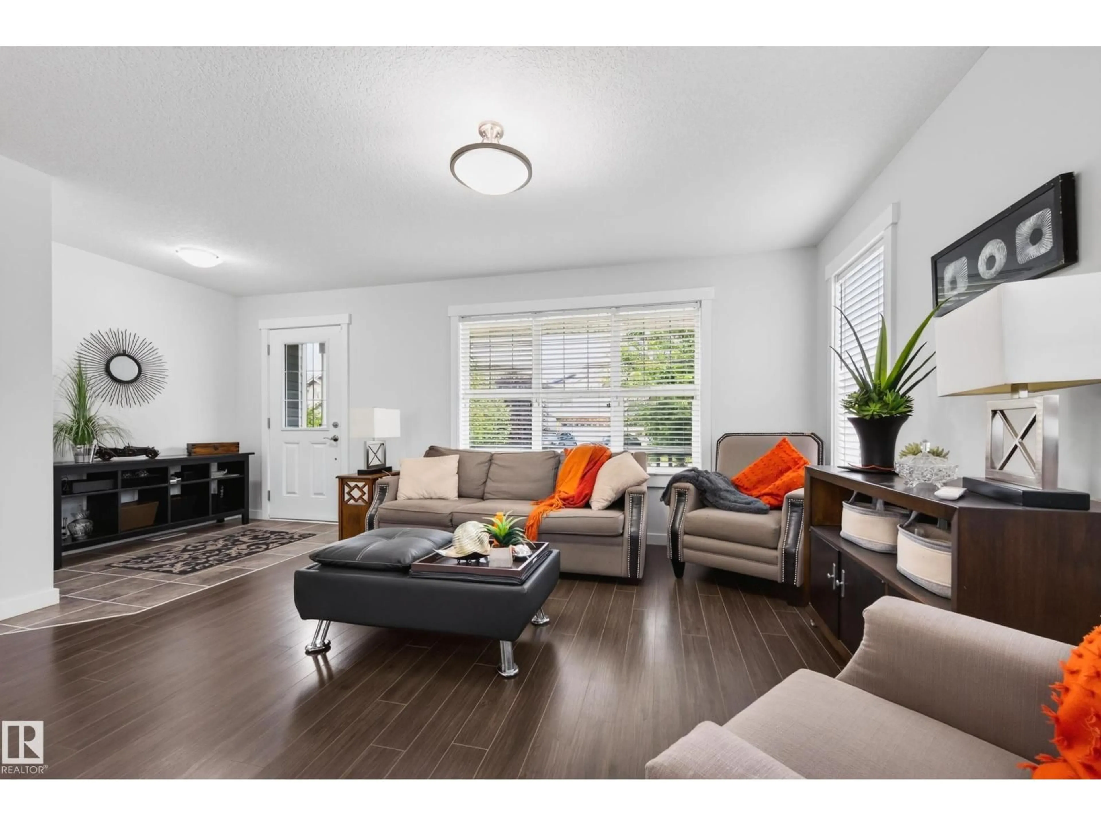 Living room with furniture, wood/laminate floor for SW - 1007 162 ST, Edmonton Alberta T6W2G9