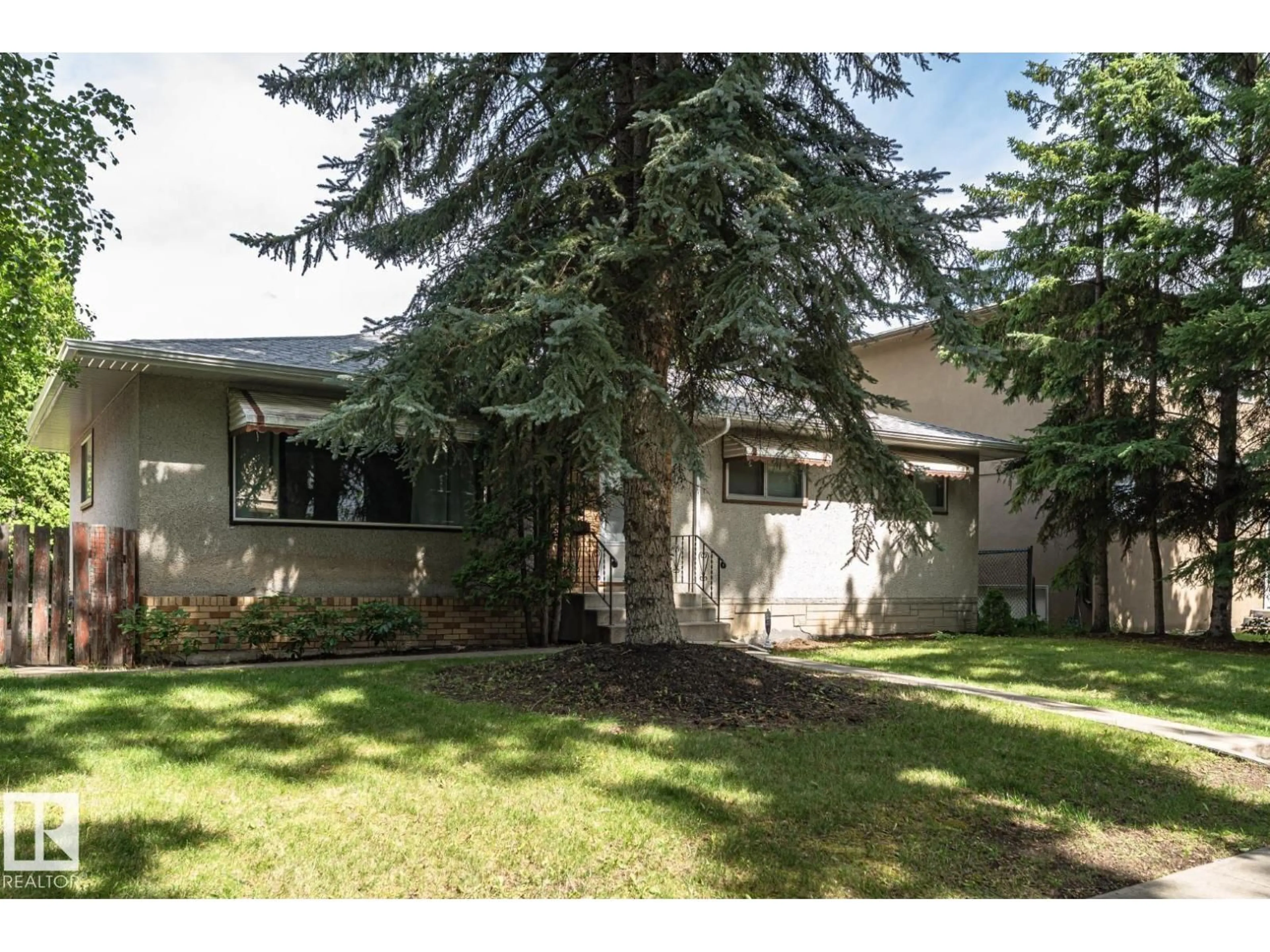 Home with vinyl exterior material, street for 10726 70 AV, Edmonton Alberta T6H2G5
