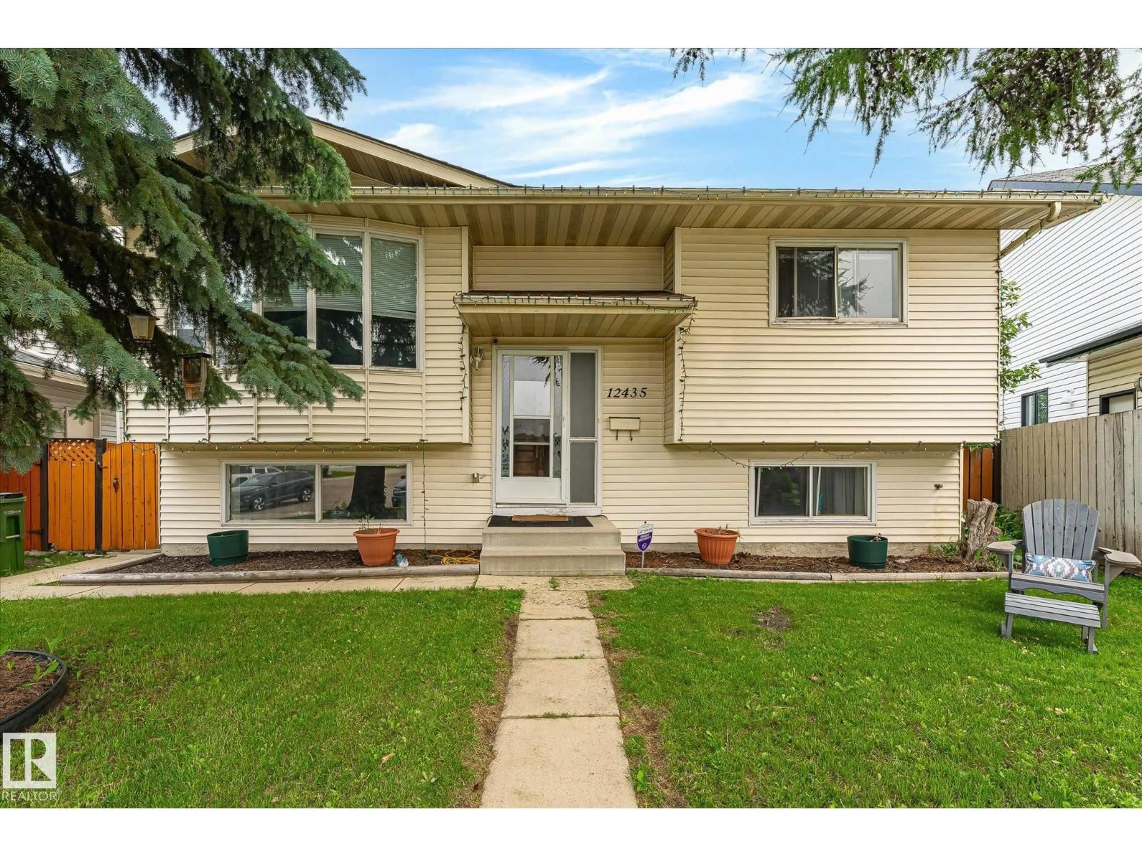Home with vinyl exterior material, street for NW - 12435 46 ST, Edmonton Alberta T5W5E2