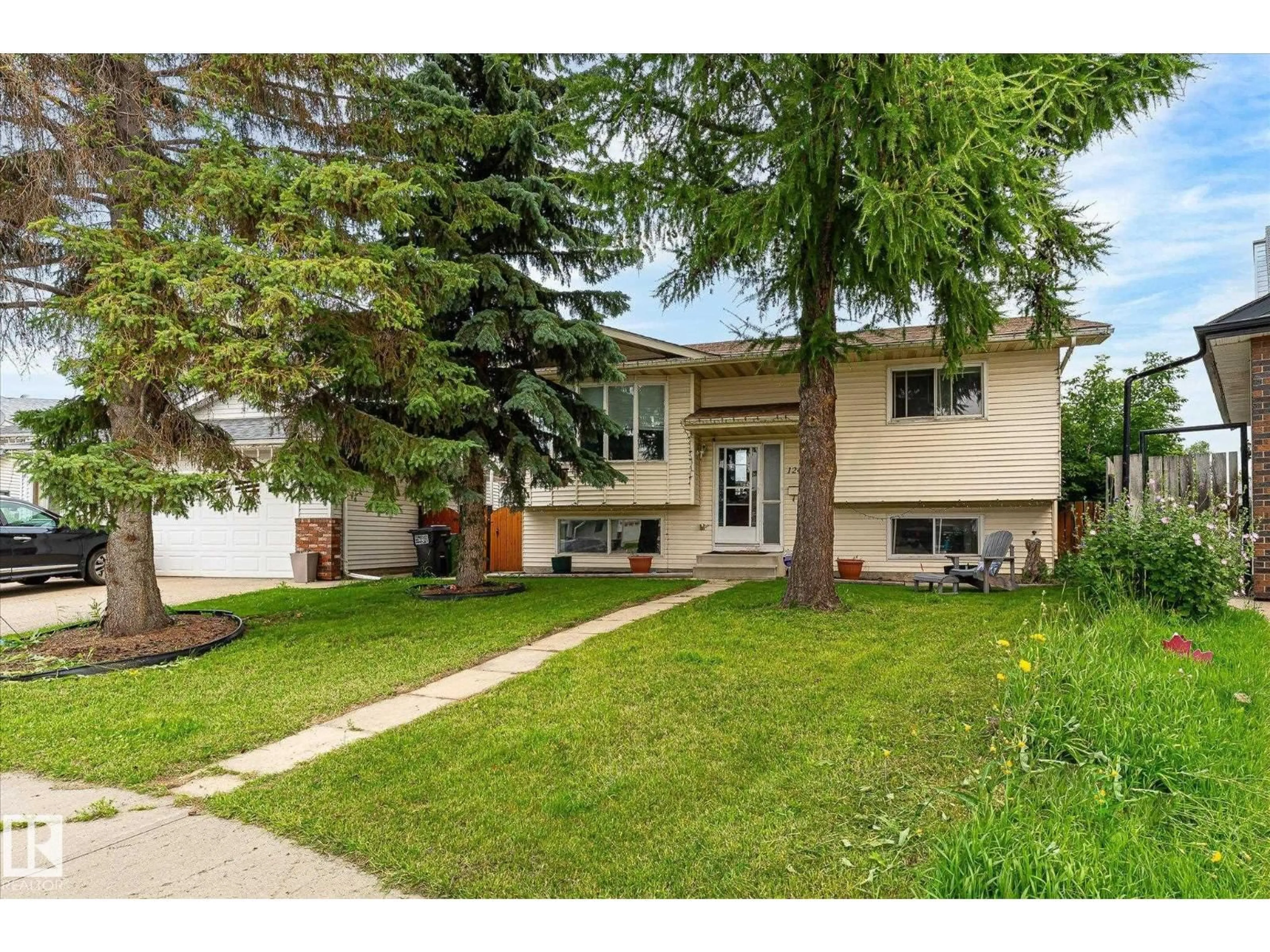 Home with vinyl exterior material, street for NW - 12435 46 ST, Edmonton Alberta T5W5E2