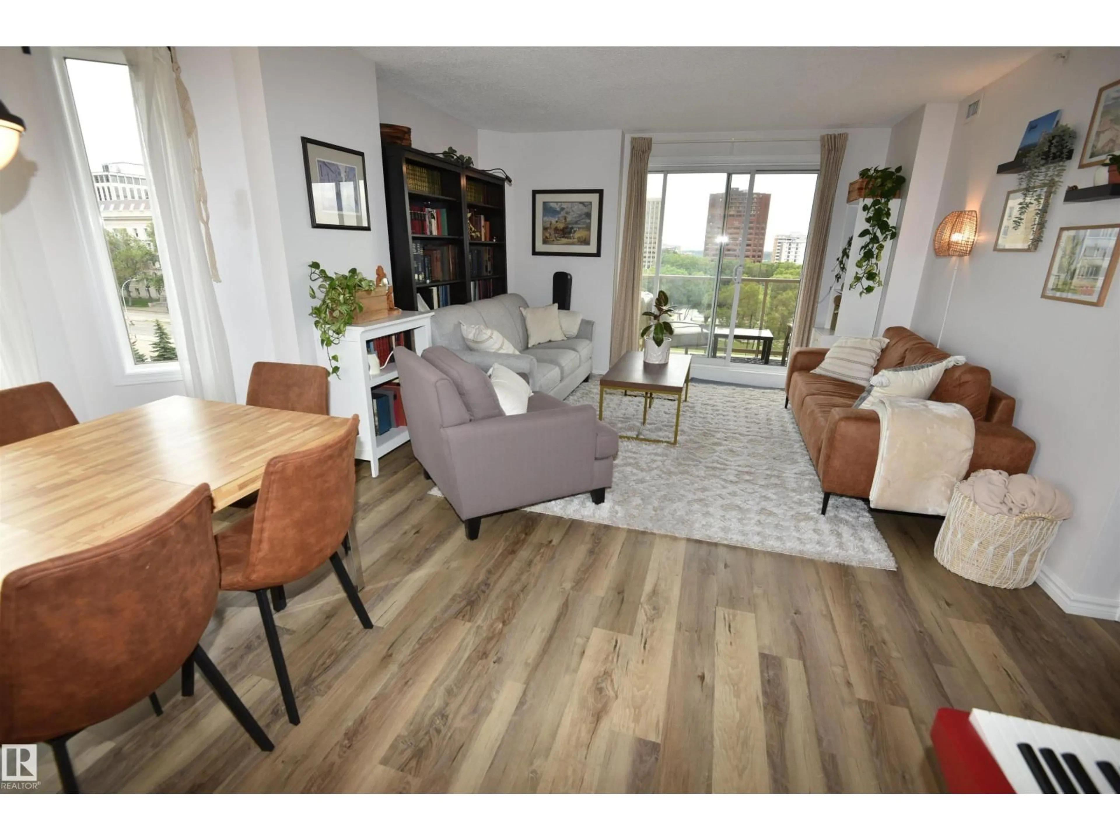 Living room with furniture, wood/laminate floor for 701 - 9741 110 ST, Edmonton Alberta T5K2Y8