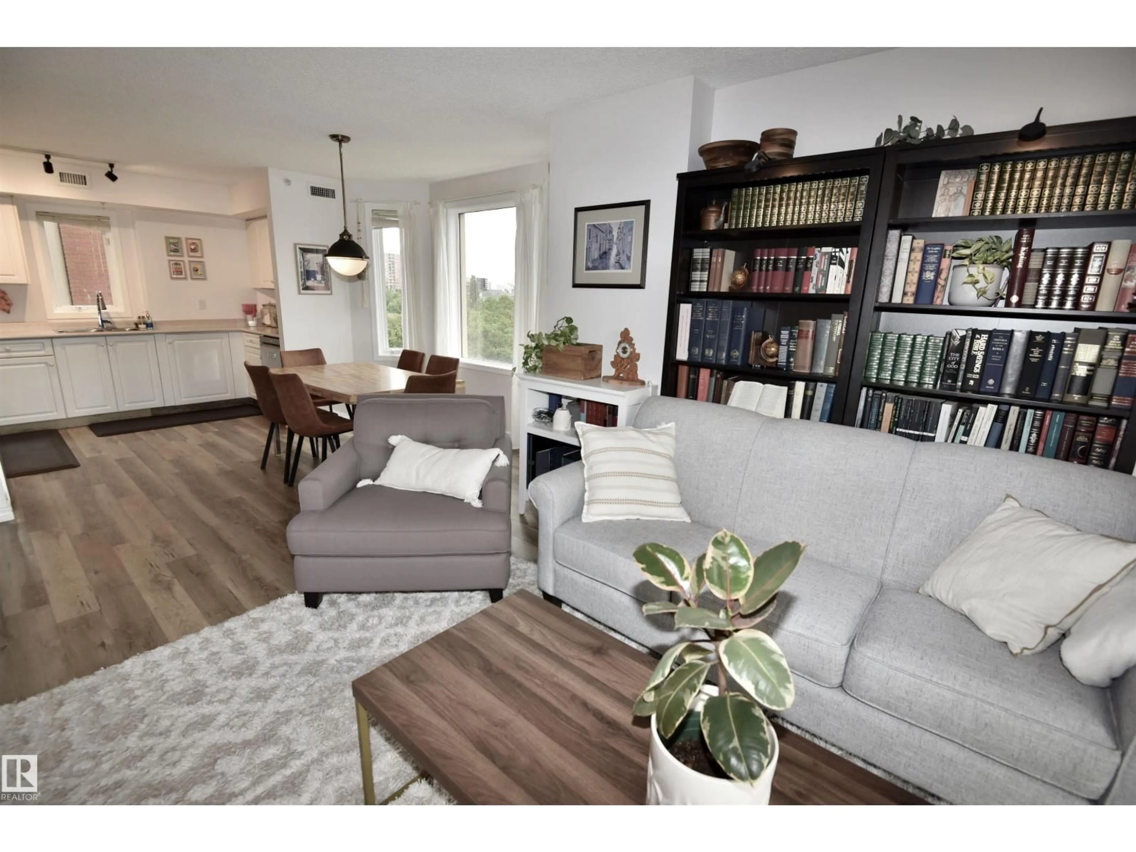 Living room with furniture, wood/laminate floor for 701 - 9741 110 ST, Edmonton Alberta T5K2Y8