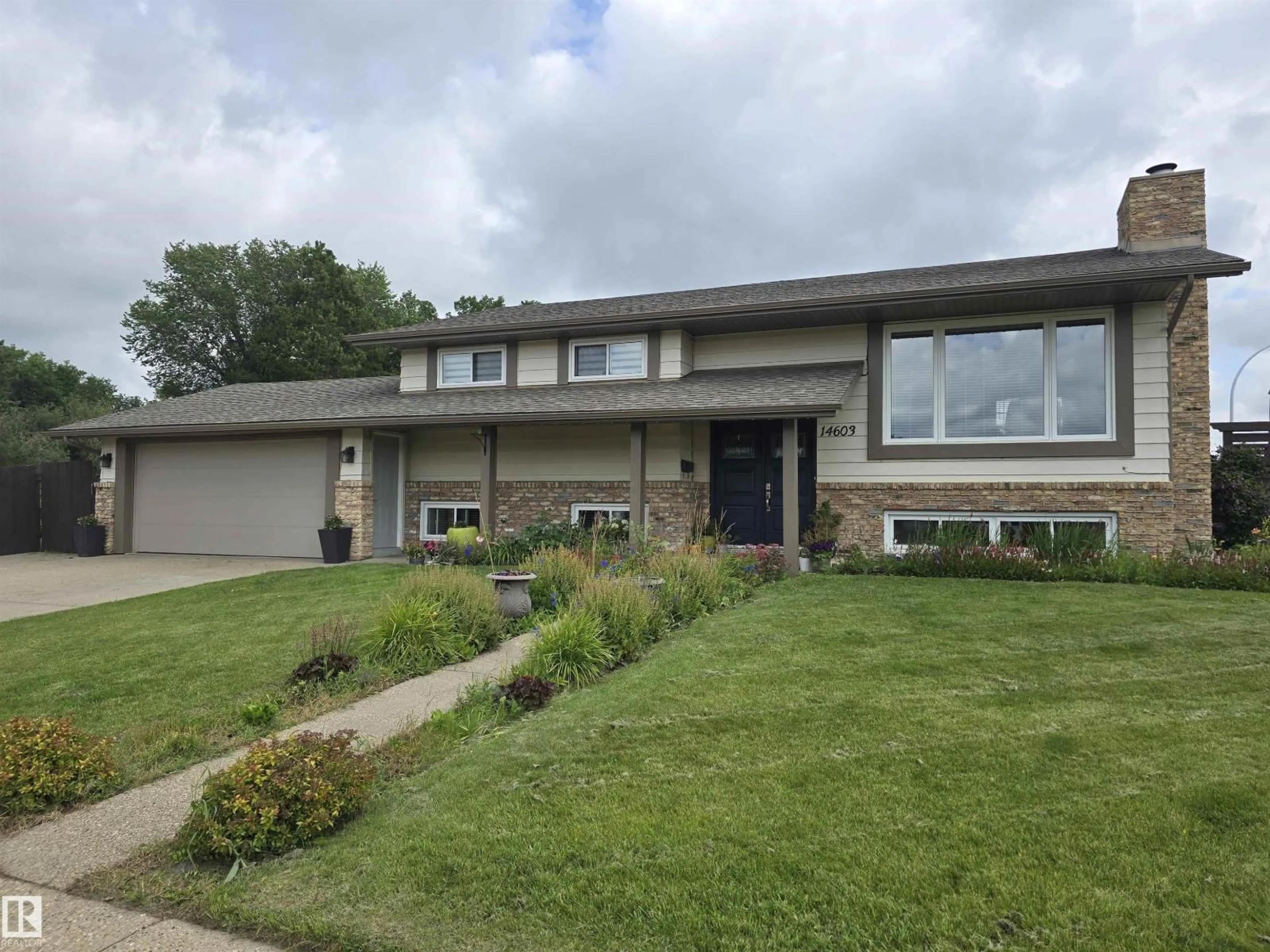 Home with vinyl exterior material, street for NW - 14603 122 ST, Edmonton Alberta T5X1V8