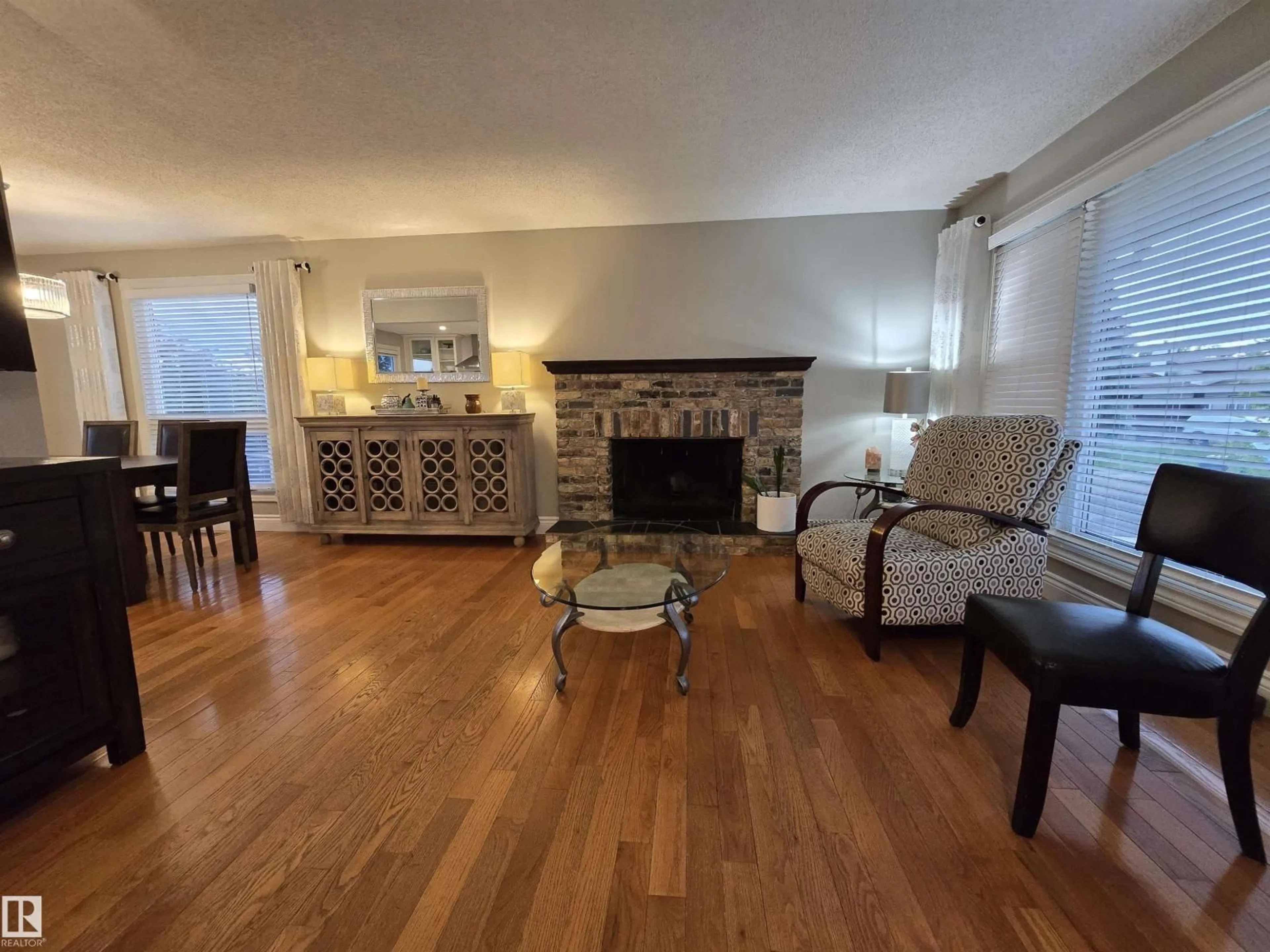 Living room with furniture, wood/laminate floor for NW - 14603 122 ST, Edmonton Alberta T5X1V8