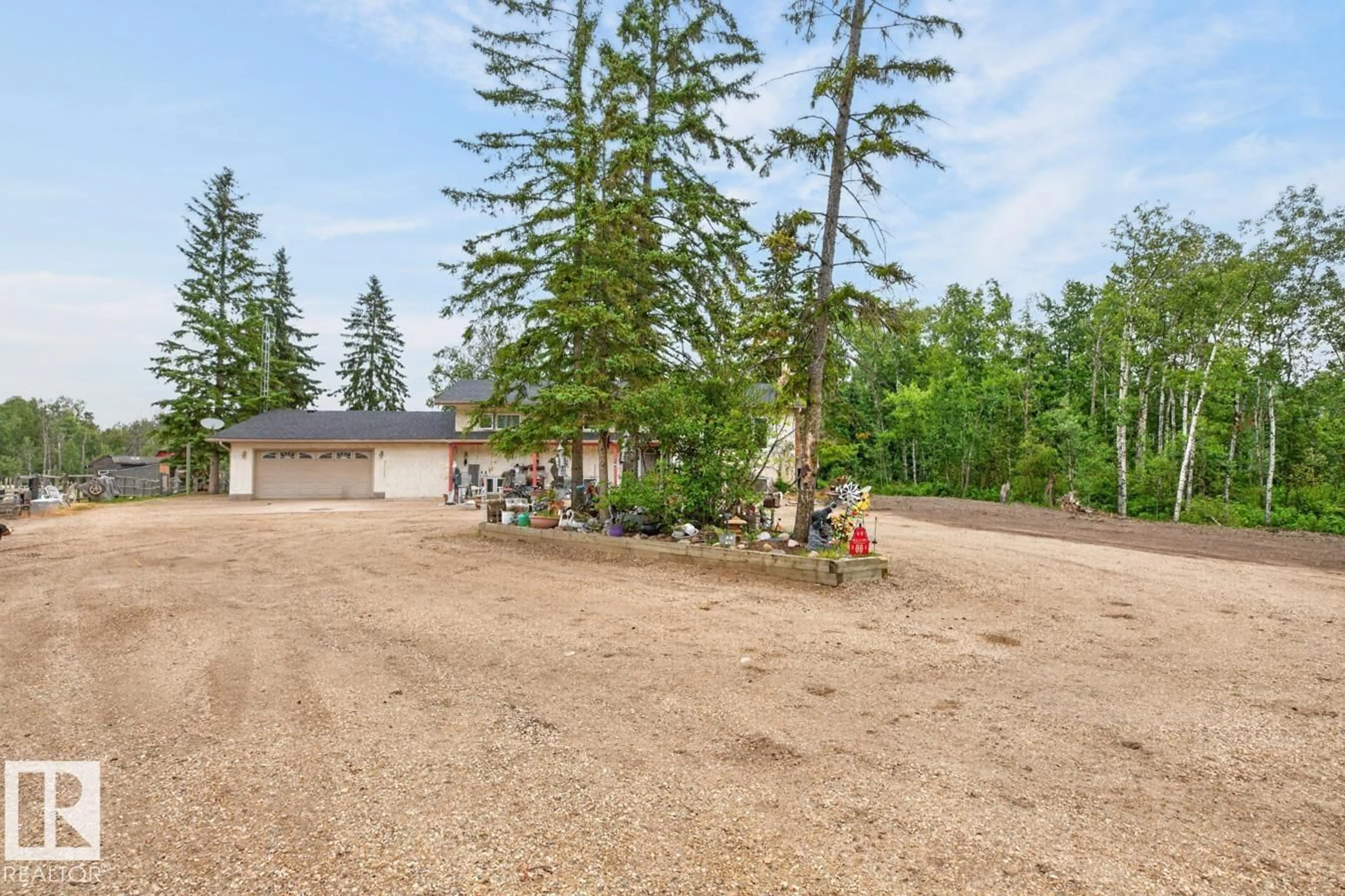 A pic from outside/outdoor area/front of a property/back of a property/a pic from drone, forest/trees view for #45 - 51404 RGE ROAD 264, Rural Parkland County Alberta T7Y1E4