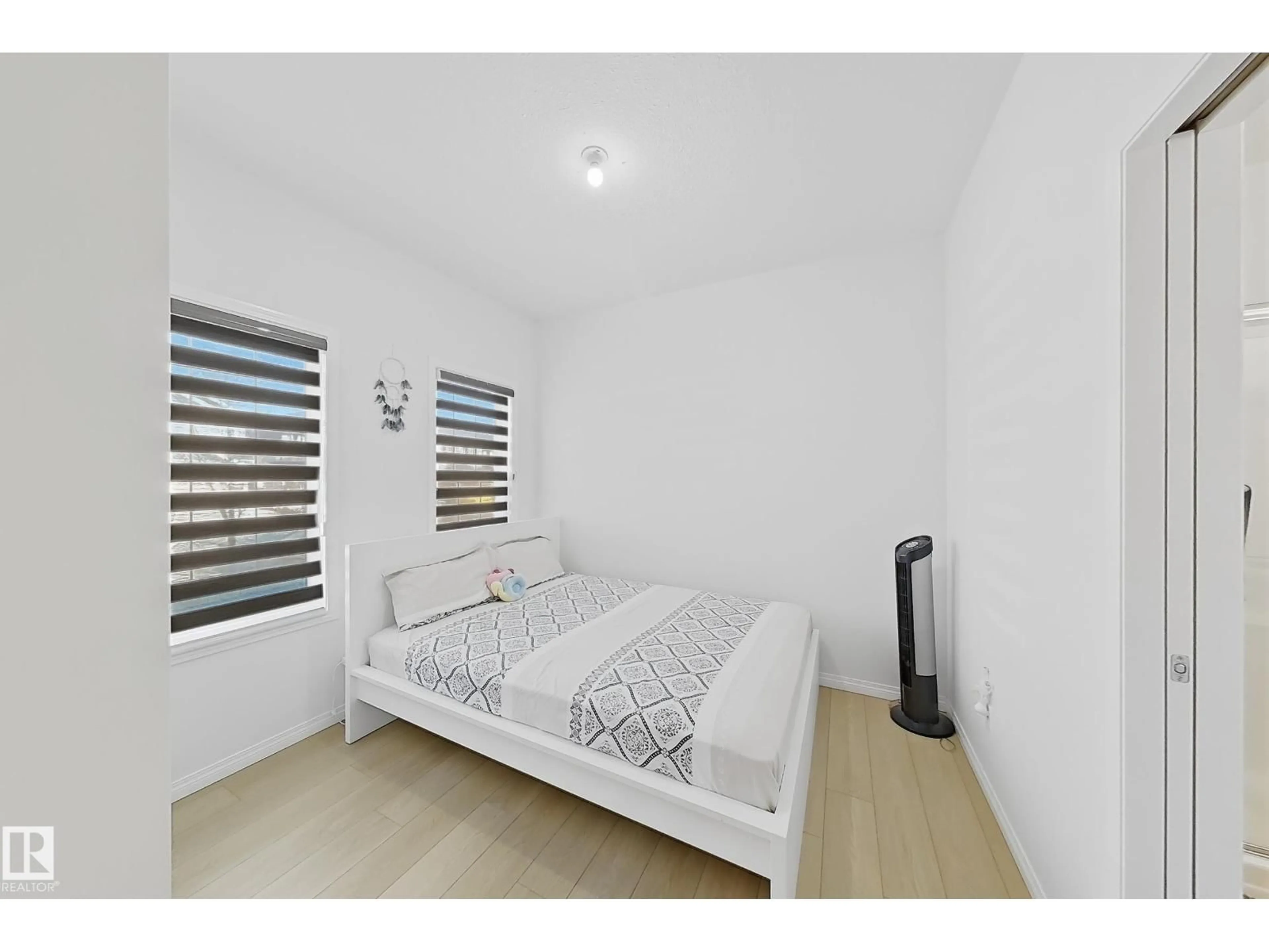 Bedroom with bed, wood/laminate floor for 1231 WATT DR, Edmonton Alberta T6X2H2