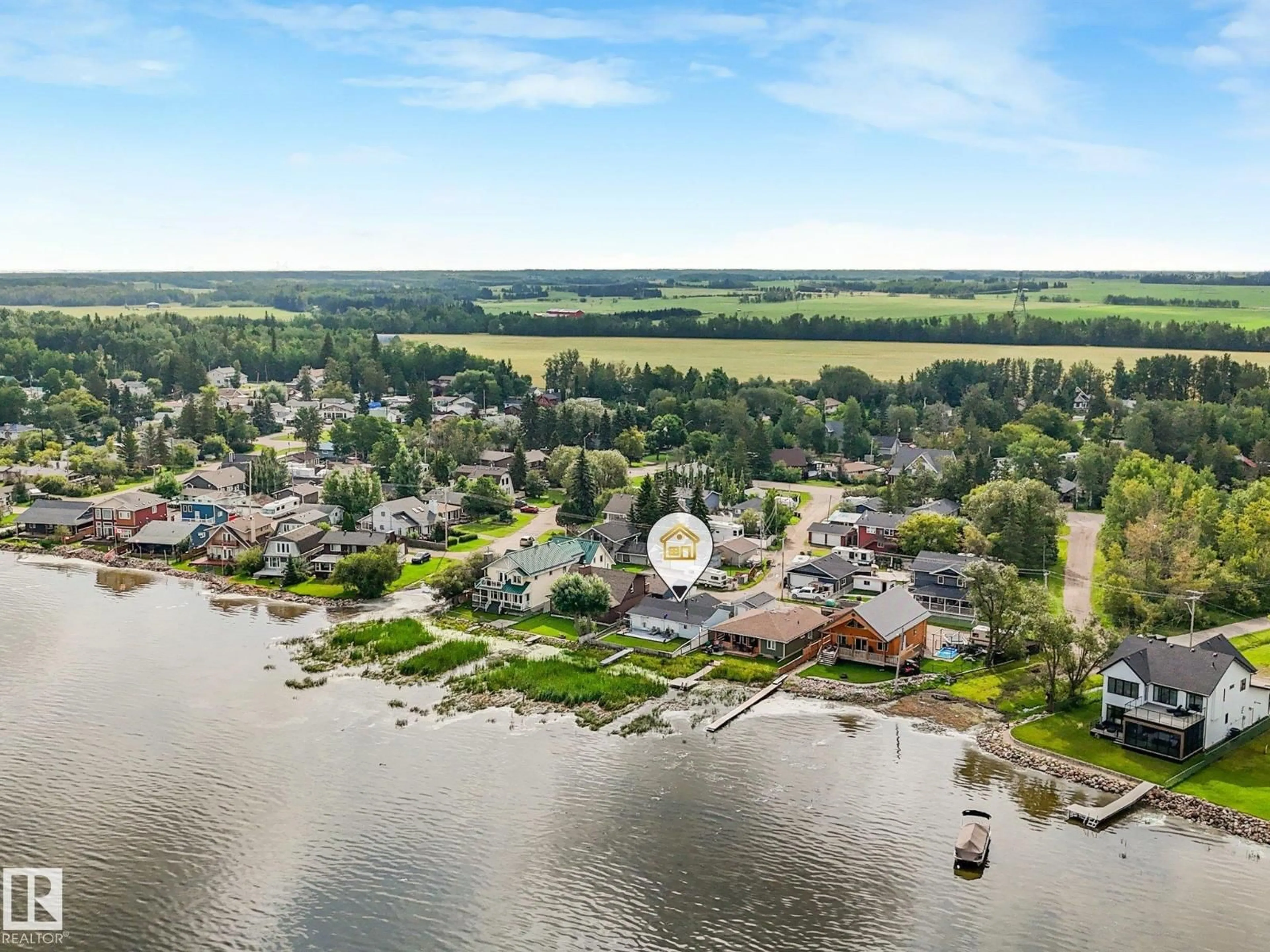 A pic from outside/outdoor area/front of a property/back of a property/a pic from drone, water/lake/river/ocean view for 5811 51 AV, Rural Lac Ste. Anne County Alberta T0E0A0