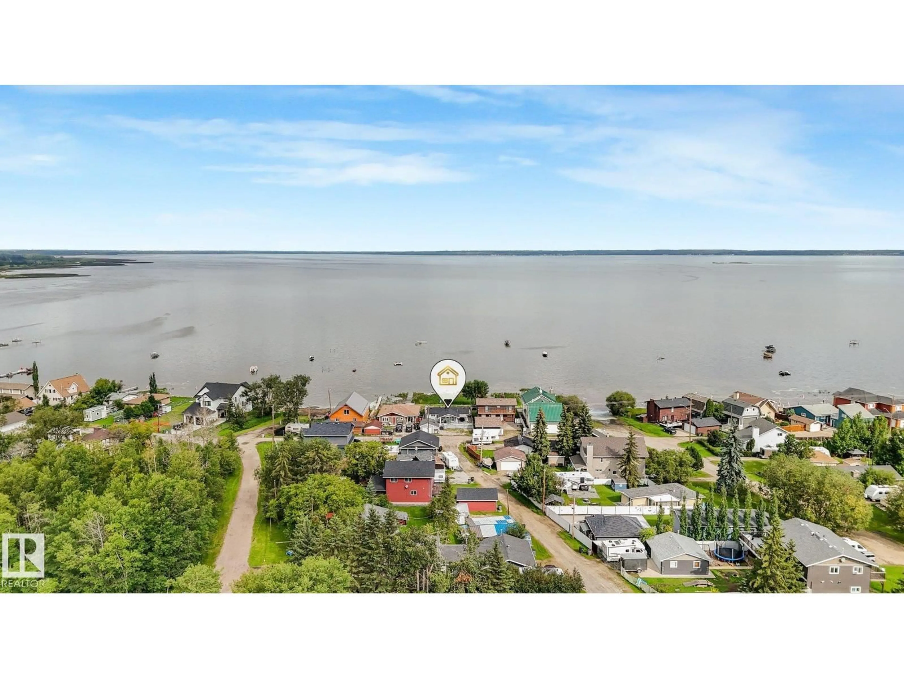 A pic from outside/outdoor area/front of a property/back of a property/a pic from drone, water/lake/river/ocean view for 5811 51 AV, Rural Lac Ste. Anne County Alberta T0E0A0