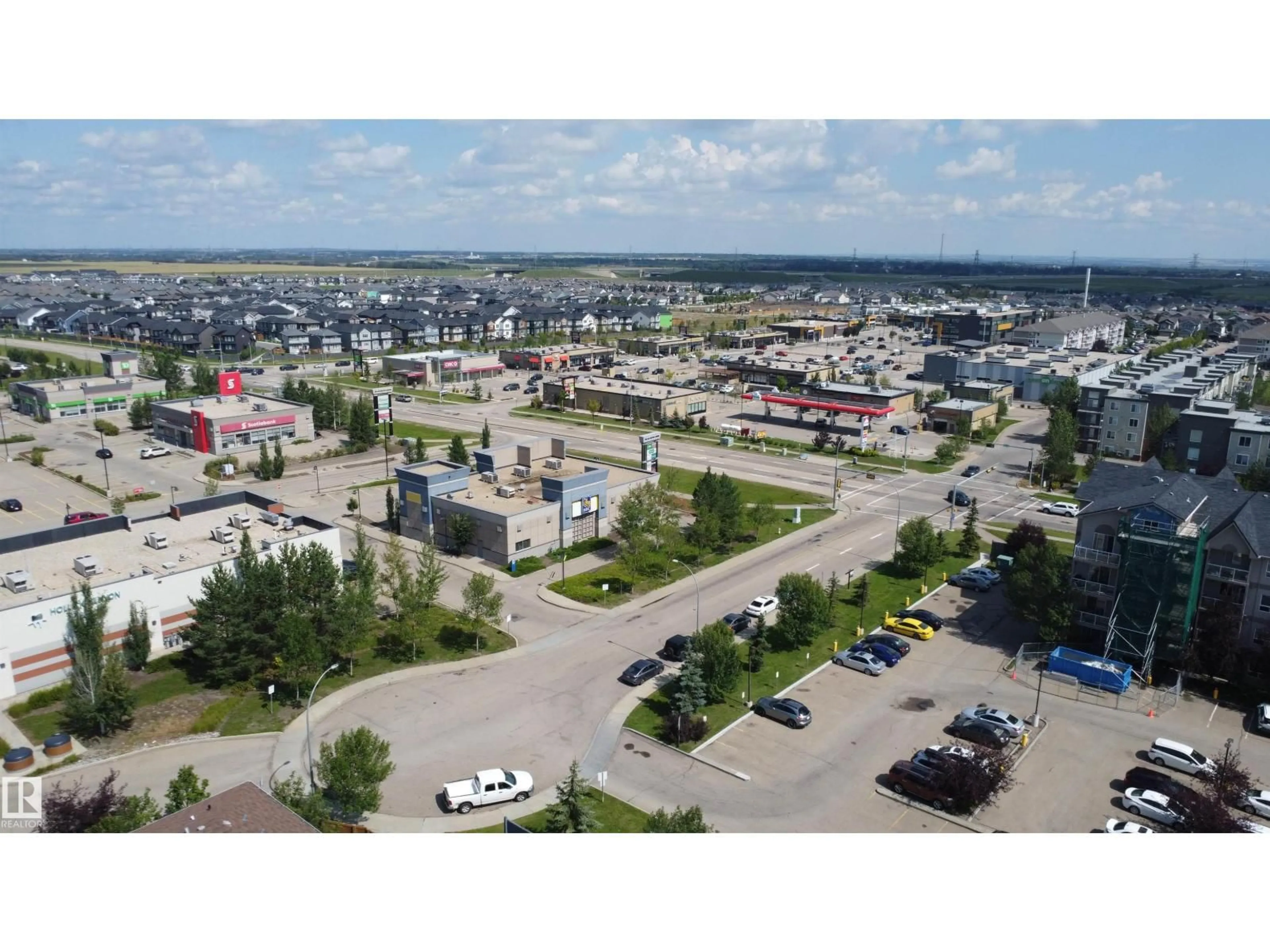 A pic from outside/outdoor area/front of a property/back of a property/a pic from drone, street for #213 - 5005 165 AV NW, Edmonton Alberta T5Y0L8