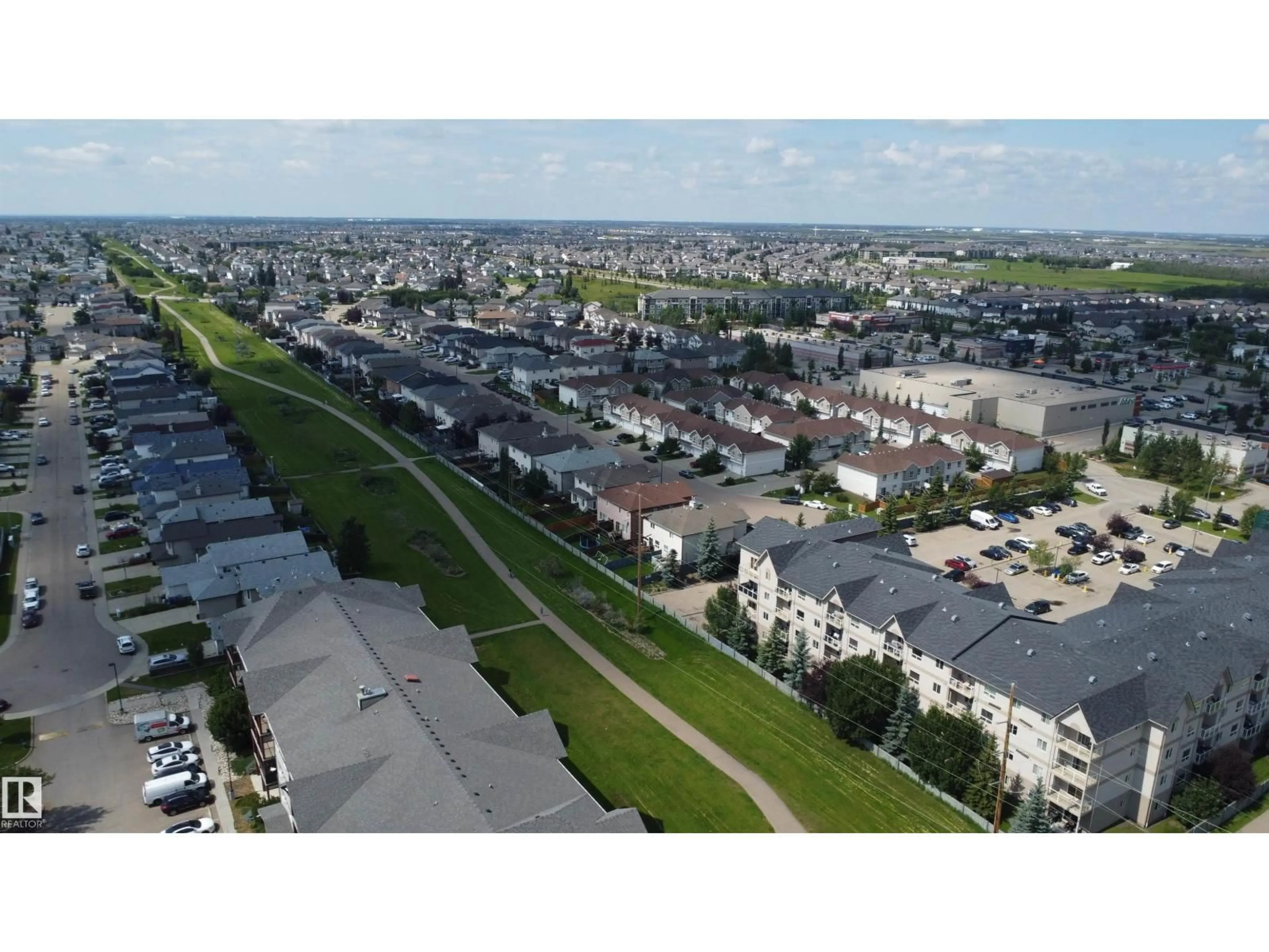 A pic from outside/outdoor area/front of a property/back of a property/a pic from drone, street for #213 - 5005 165 AV NW, Edmonton Alberta T5Y0L8