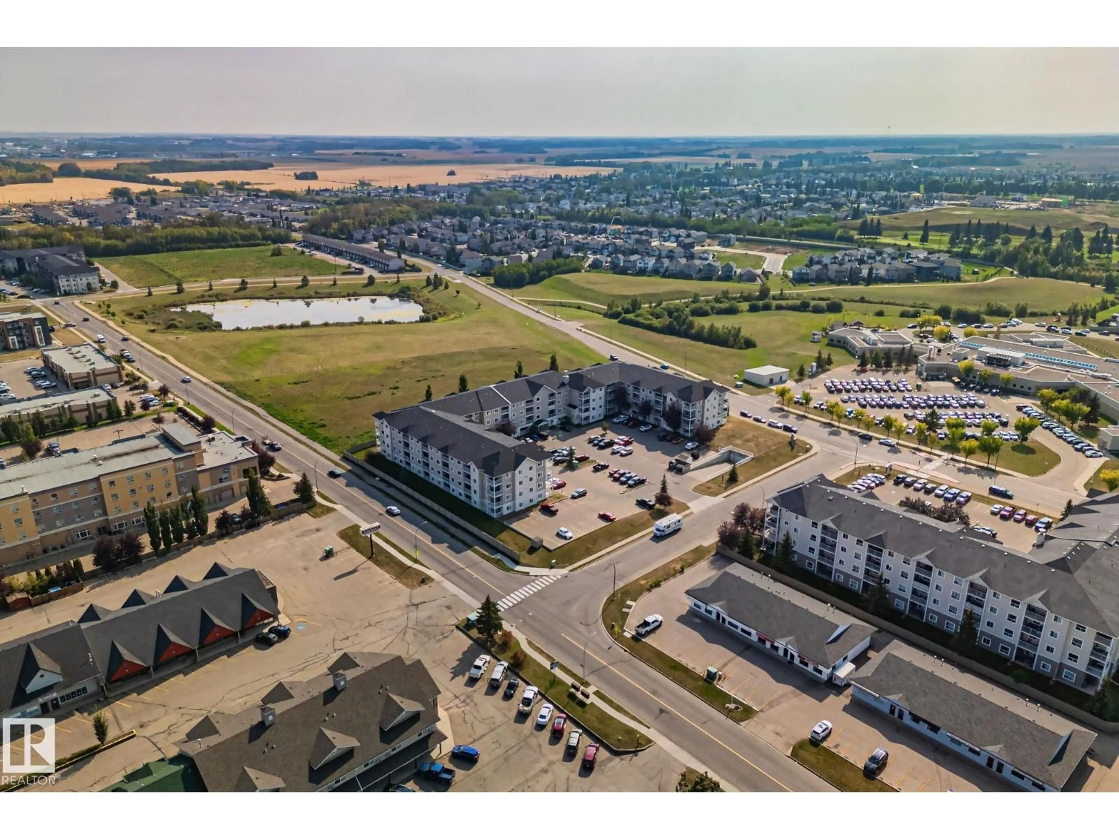 A pic from outside/outdoor area/front of a property/back of a property/a pic from drone, unknown for 407 - 4309 33 ST, Stony Plain Alberta T7Z0C4