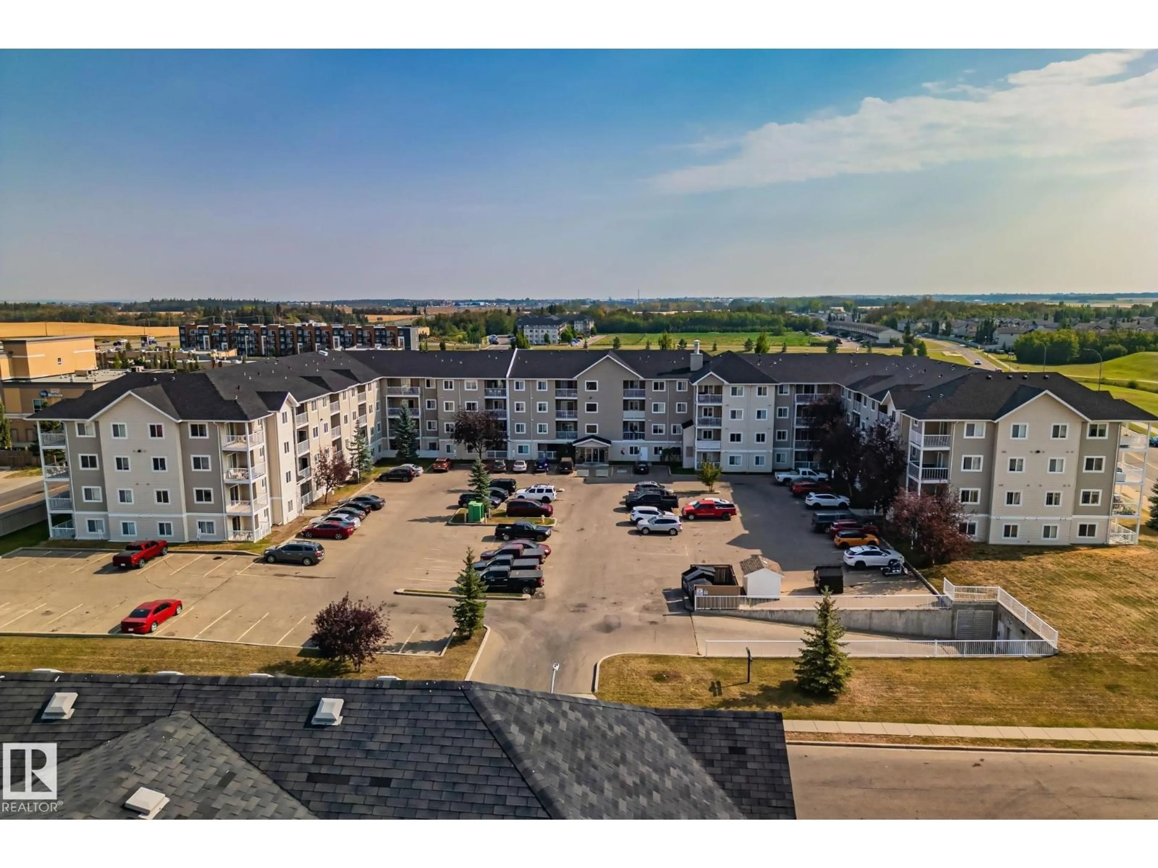 A pic from outside/outdoor area/front of a property/back of a property/a pic from drone, unknown for 407 - 4309 33 ST, Stony Plain Alberta T7Z0C4