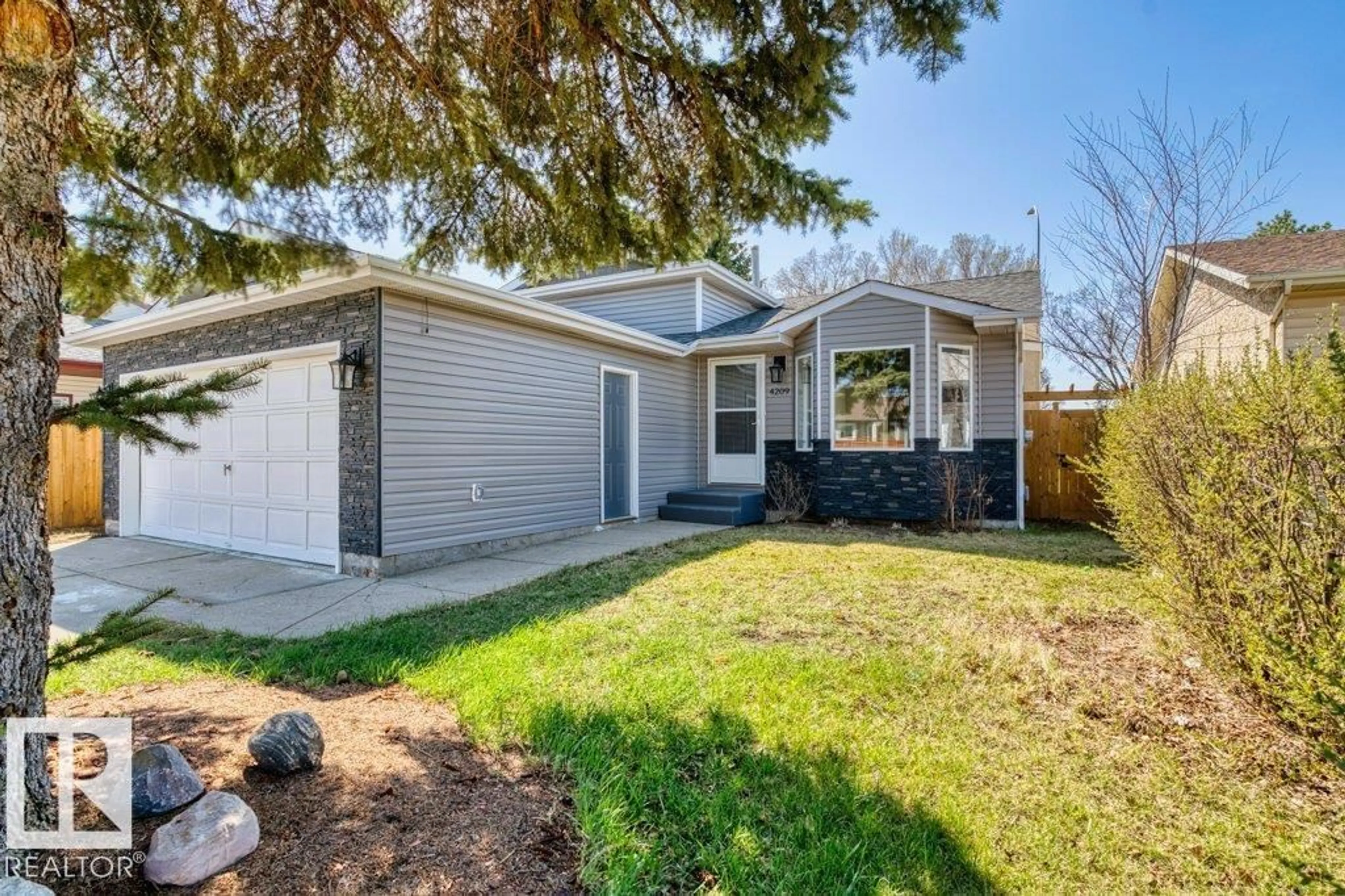 Home with vinyl exterior material, street for 4209 25 AV, Edmonton Alberta T6L6B4