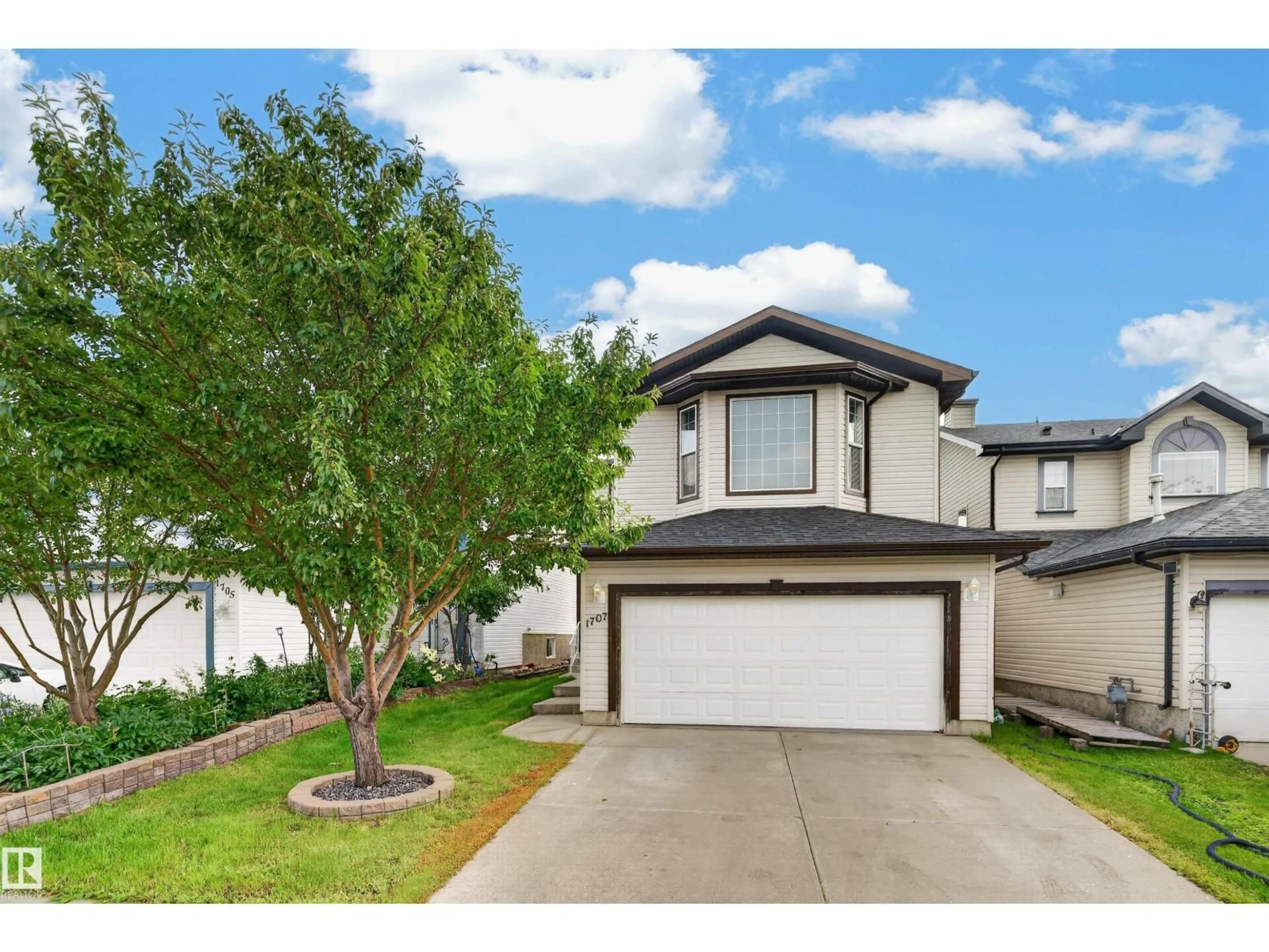 Home with vinyl exterior material, street for 1707 37A AV, Edmonton Alberta T6T1X9