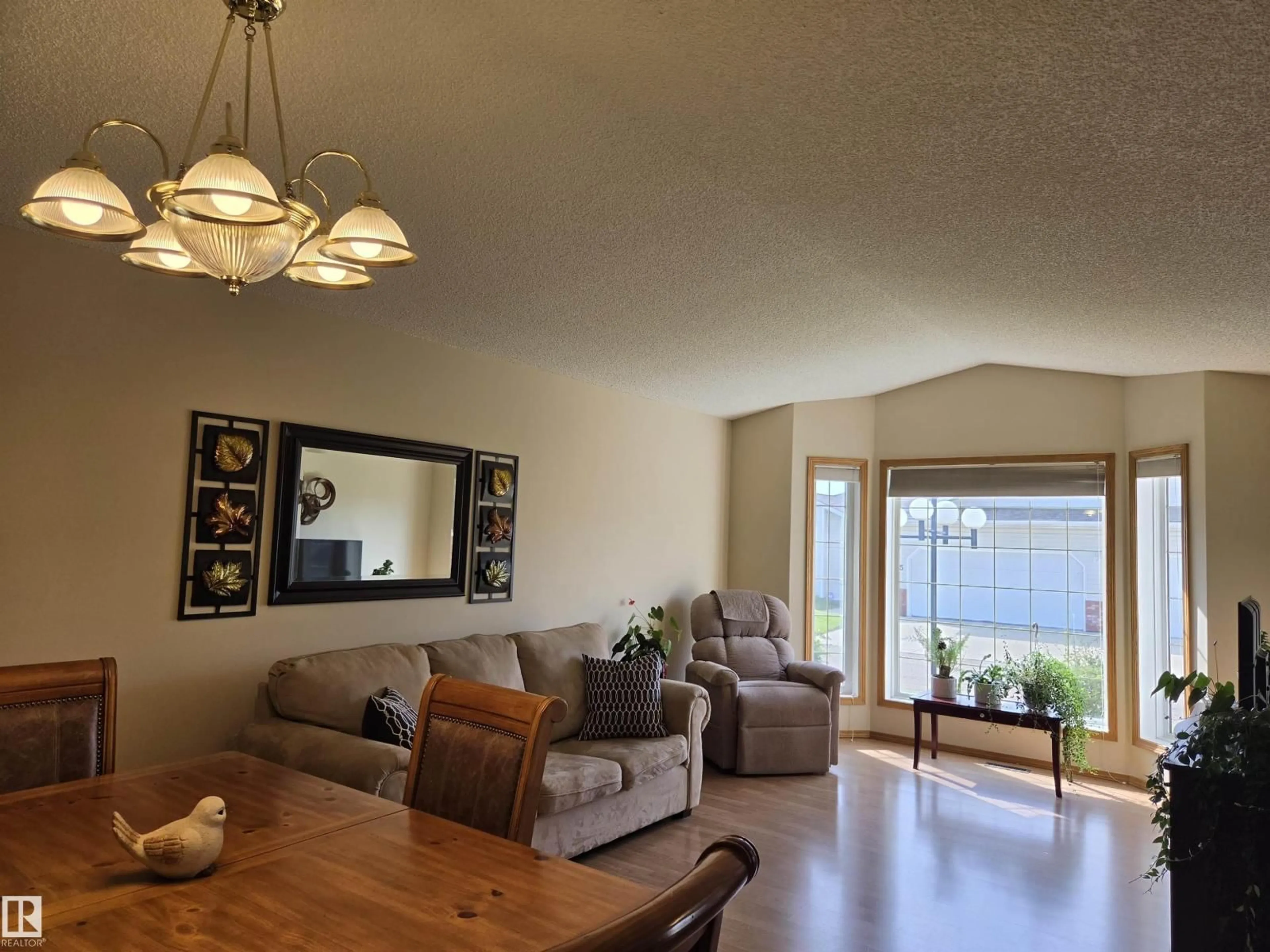 Living room with furniture, wood/laminate floor for 7 - 29 CRANFORD WY, Sherwood Park Alberta T8H5W5