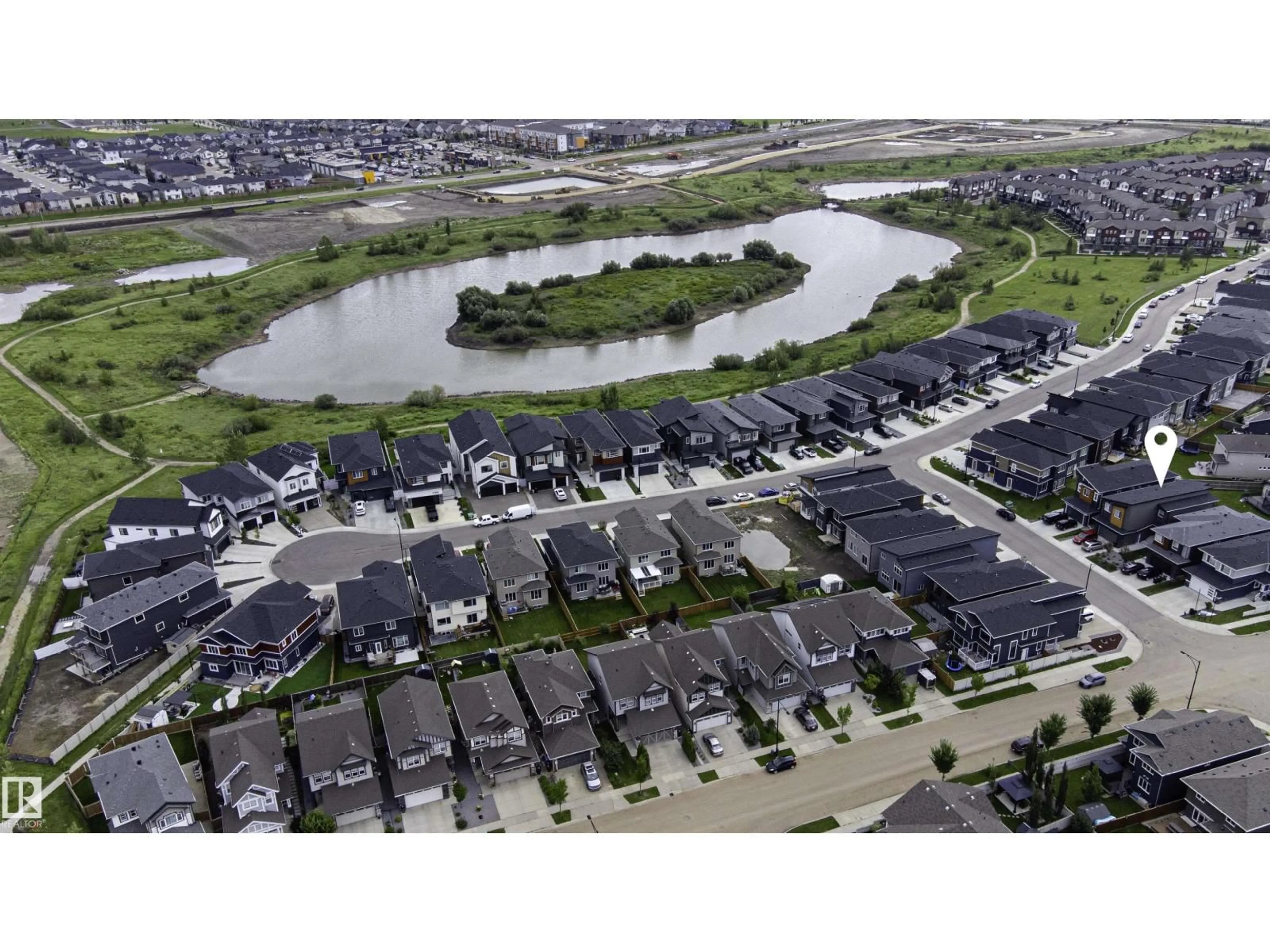 A pic from outside/outdoor area/front of a property/back of a property/a pic from drone, water/lake/river/ocean view for 6907 173 AV, Edmonton Alberta T5Z0W4