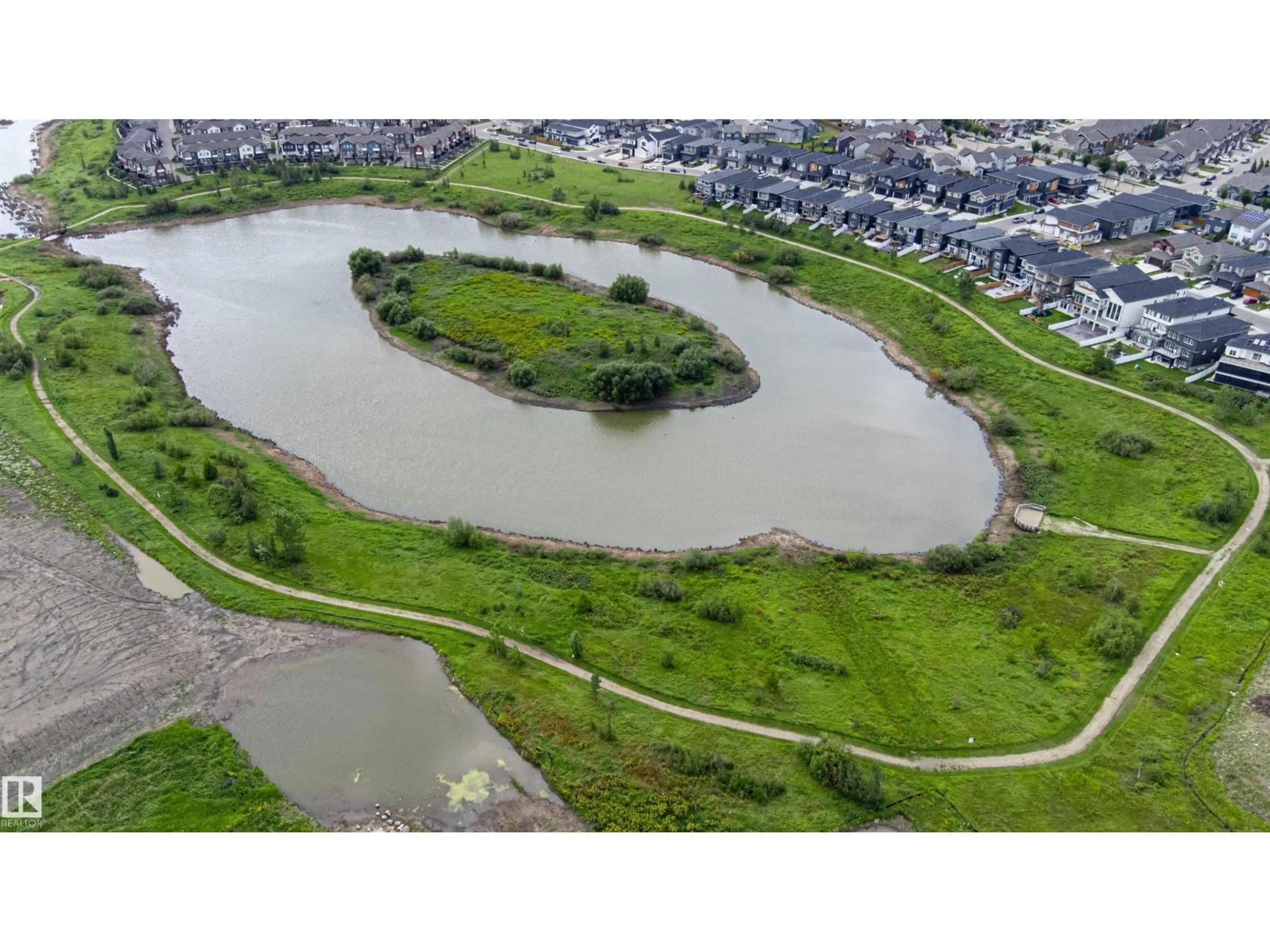 A pic from outside/outdoor area/front of a property/back of a property/a pic from drone, water/lake/river/ocean view for 6907 173 AV, Edmonton Alberta T5Z0W4