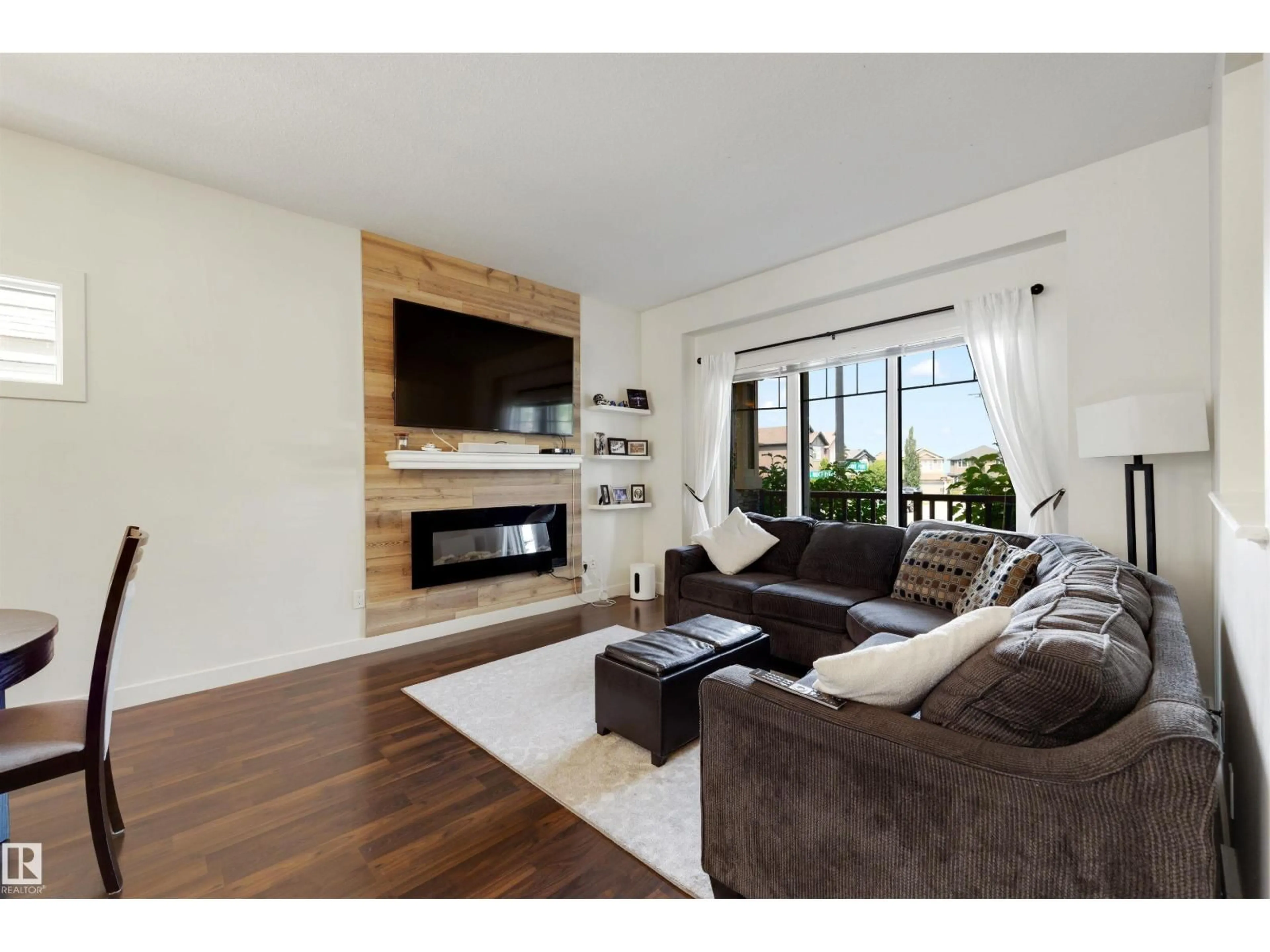 Living room with furniture, wood/laminate floor for NW - 171 HAWKS RIDGE BV, Edmonton Alberta T5S0H6