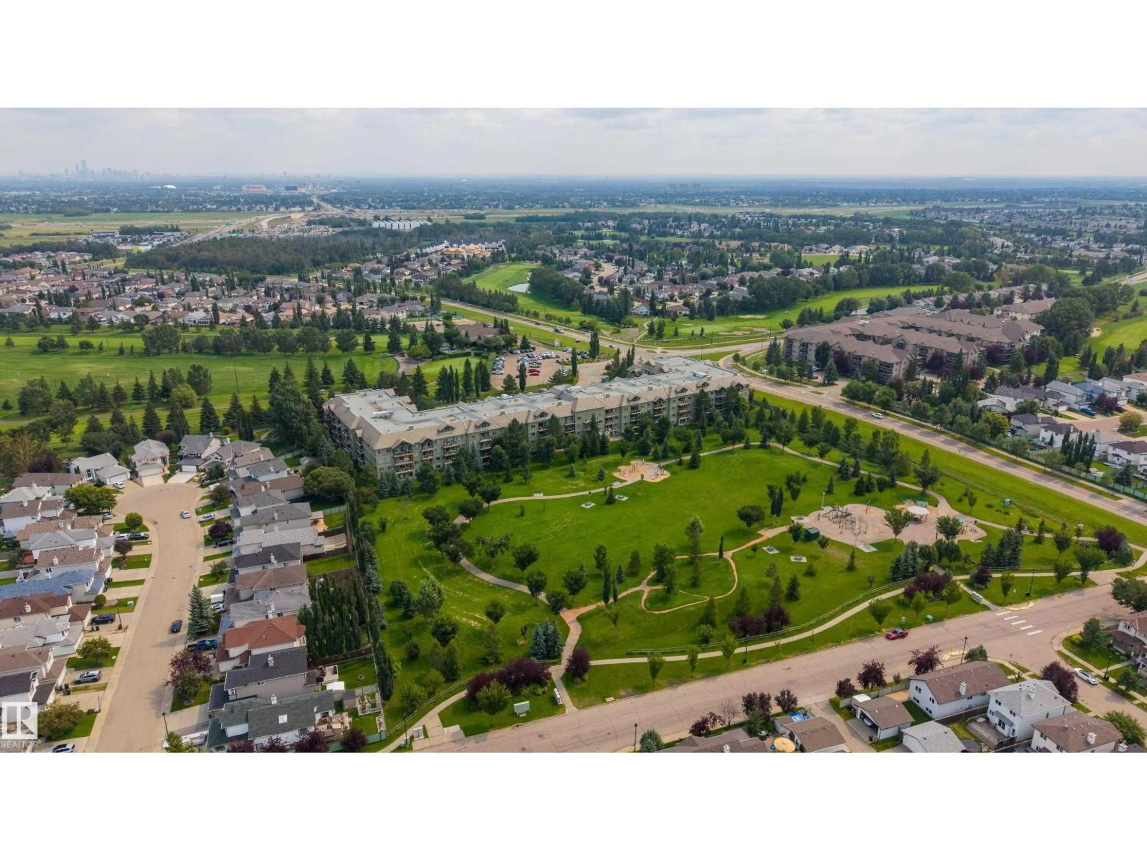A pic from outside/outdoor area/front of a property/back of a property/a pic from drone, unknown for #108 - 278 SUDER GREENS DR, Edmonton Alberta T5T6V6