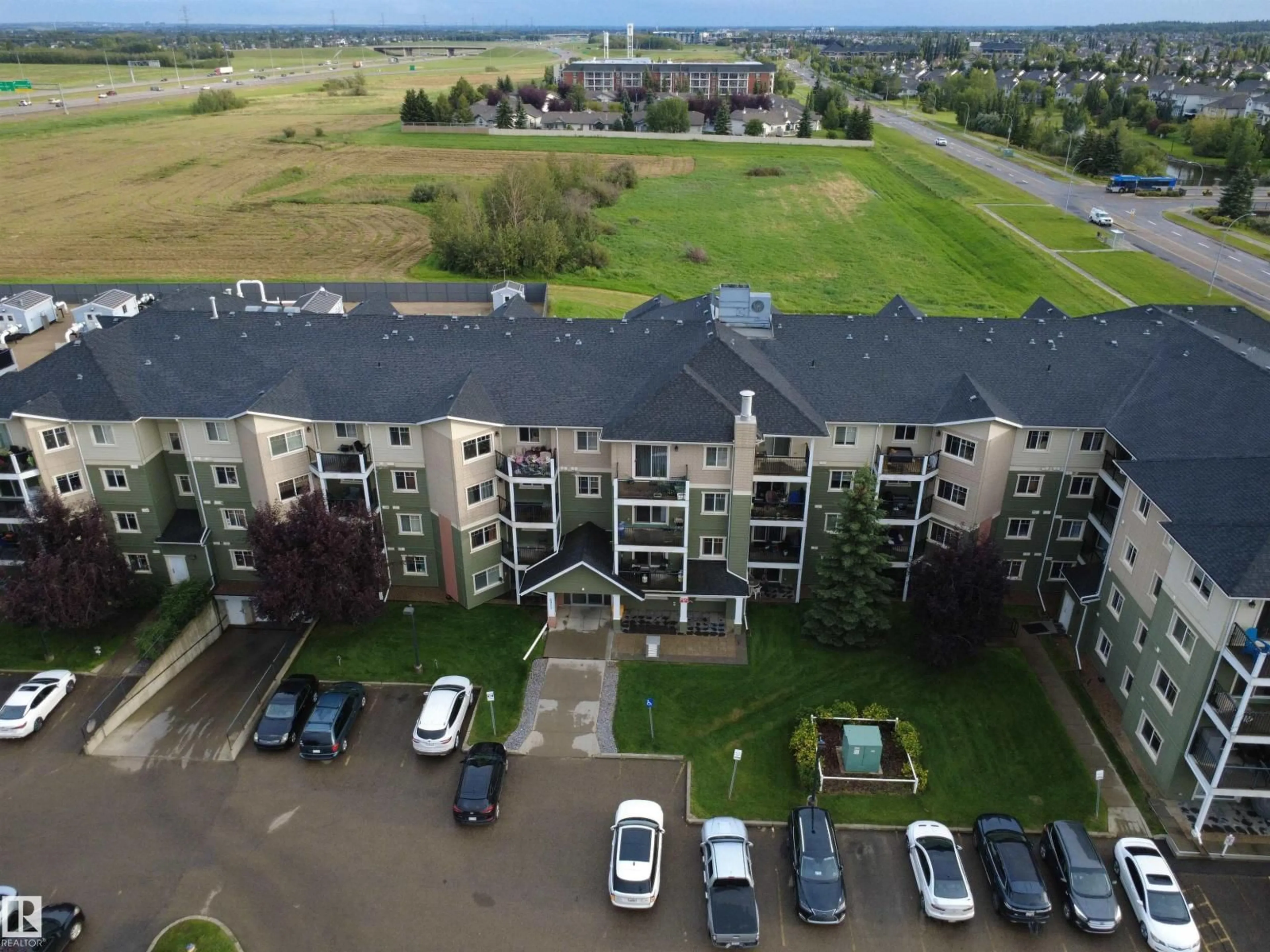 A pic from outside/outdoor area/front of a property/back of a property/a pic from drone, city buildings view from balcony for 208 - 6921 199 ST, Edmonton Alberta T5T3X7