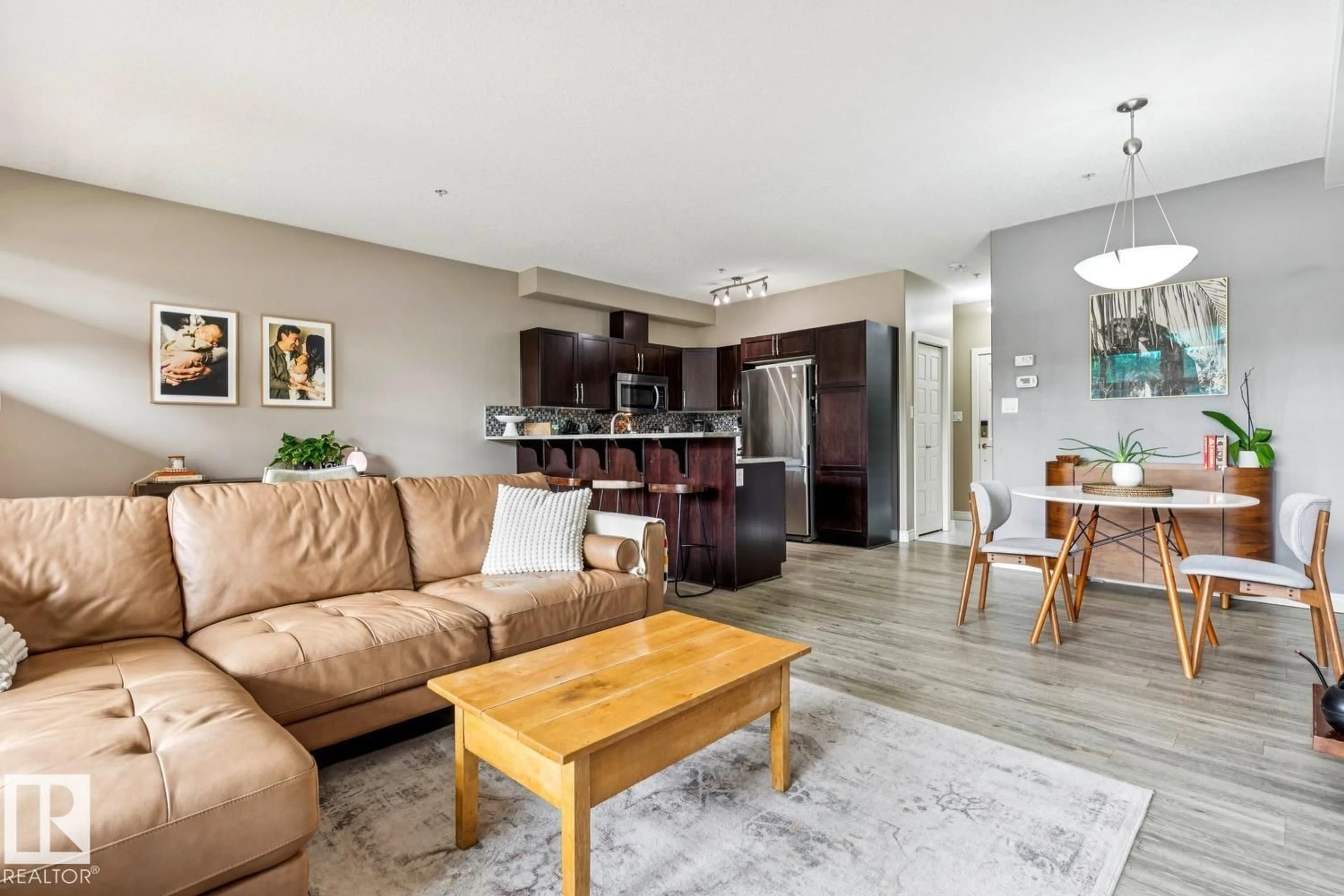 Living room with furniture, wood/laminate floor for #104 - 9603 98 AV, Edmonton Alberta T6C2E2