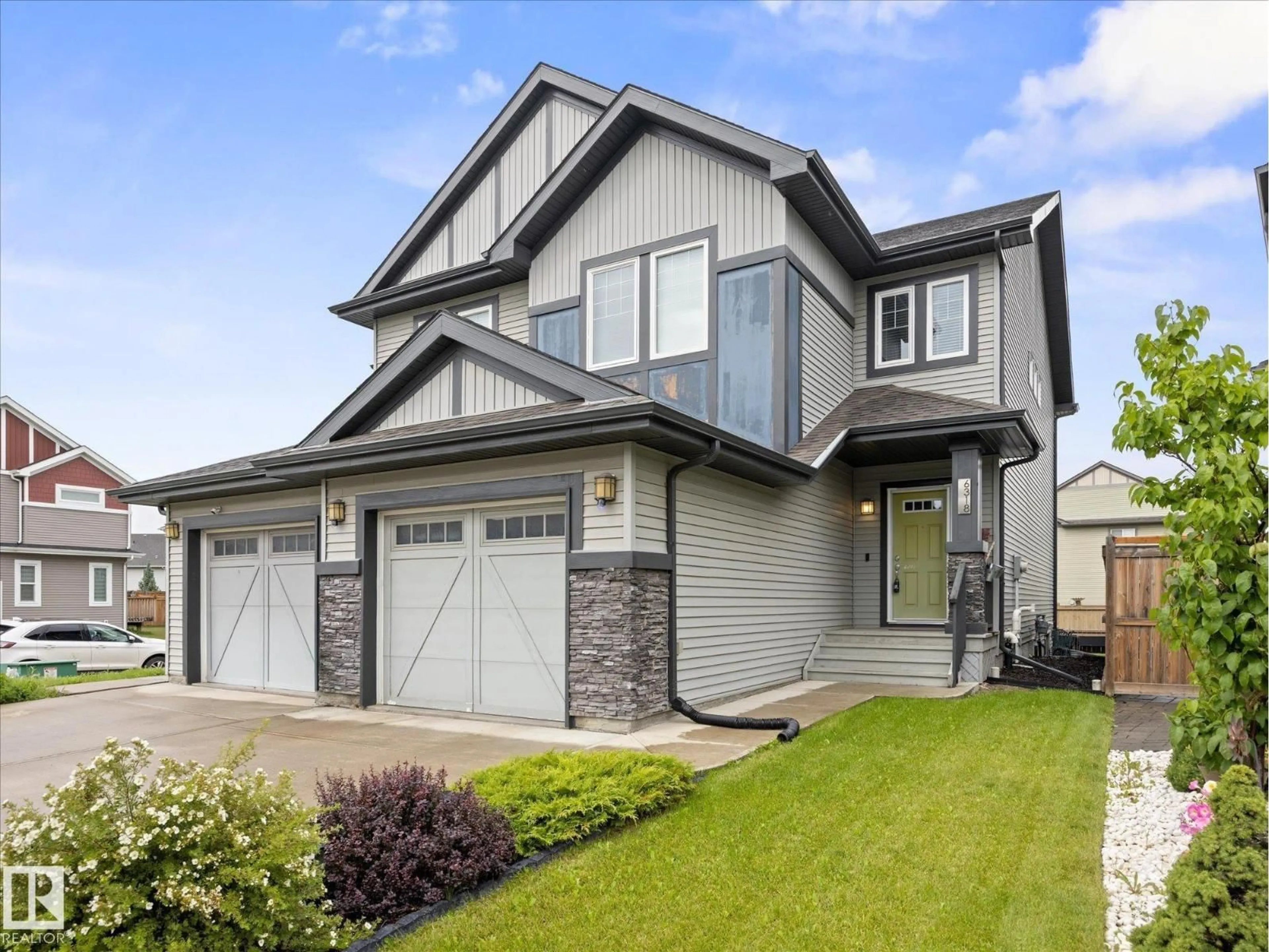 Home with vinyl exterior material, street for 6318 167A AV, Edmonton Alberta T5Y3P7